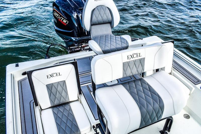 2026 Excel 230 Bay Pro Elite boat seats with diamond stitching on water.