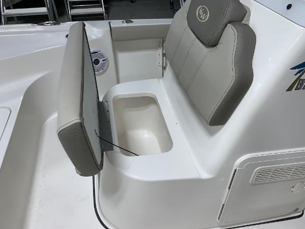 2024 Key West 188 Bay Reef boat with open storage compartment under seat.