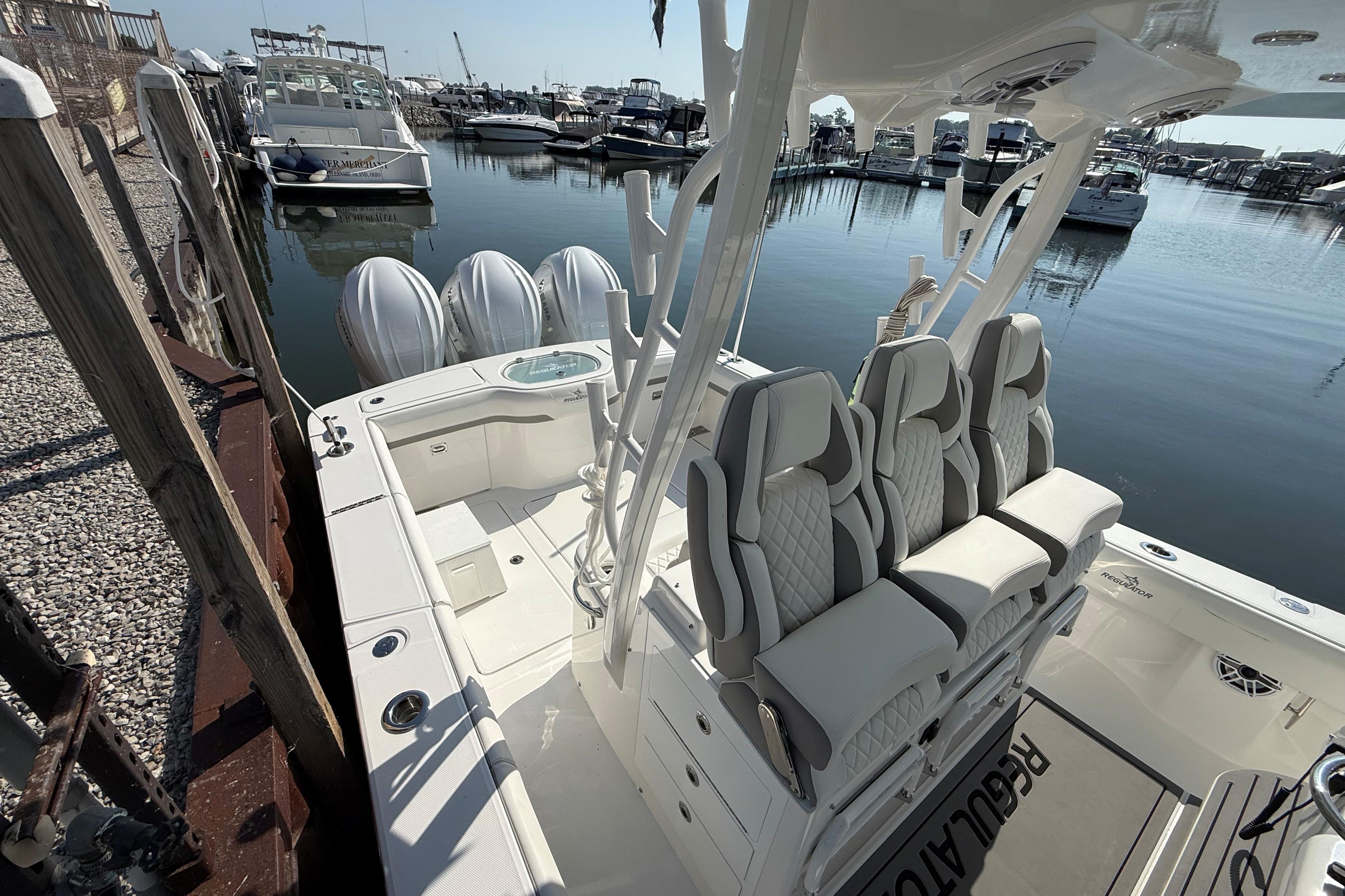 2026 Regulator 35 boat with luxurious seating at a marina dock.