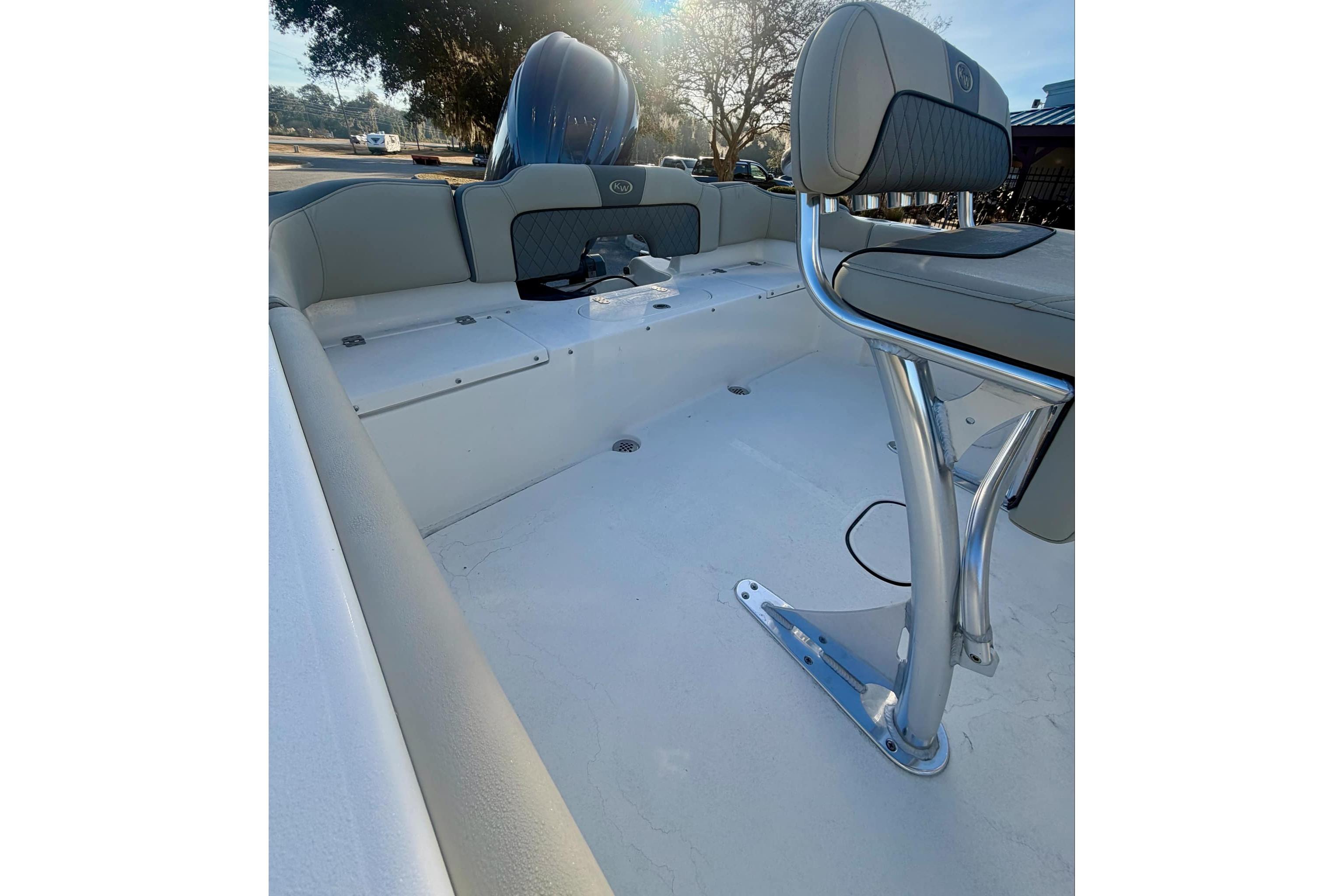 2026 Key West 203 FS boat interior with seating and console, showcasing modern design.