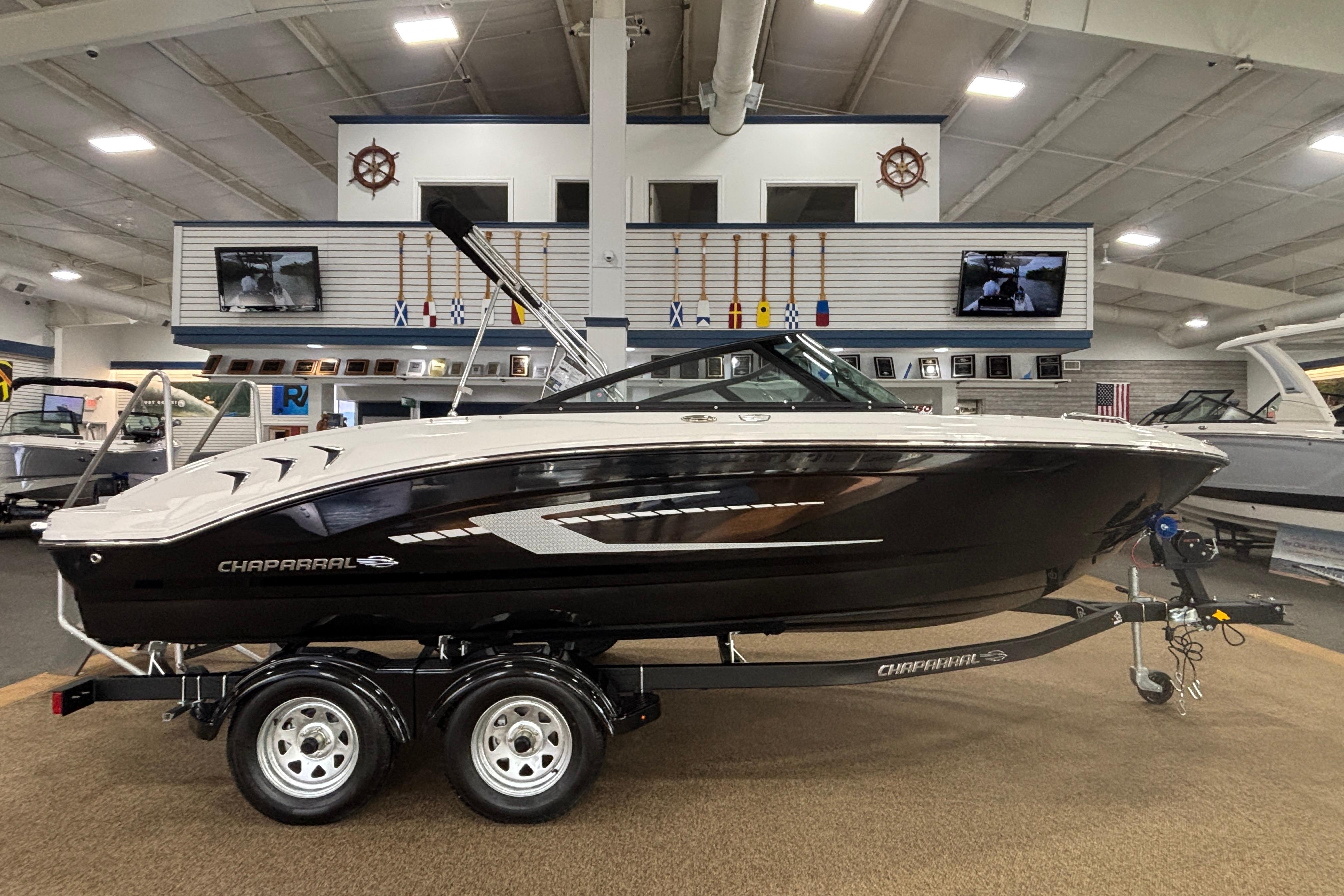 2026 Chaparral 21 SSi boat in showroom on trailer.