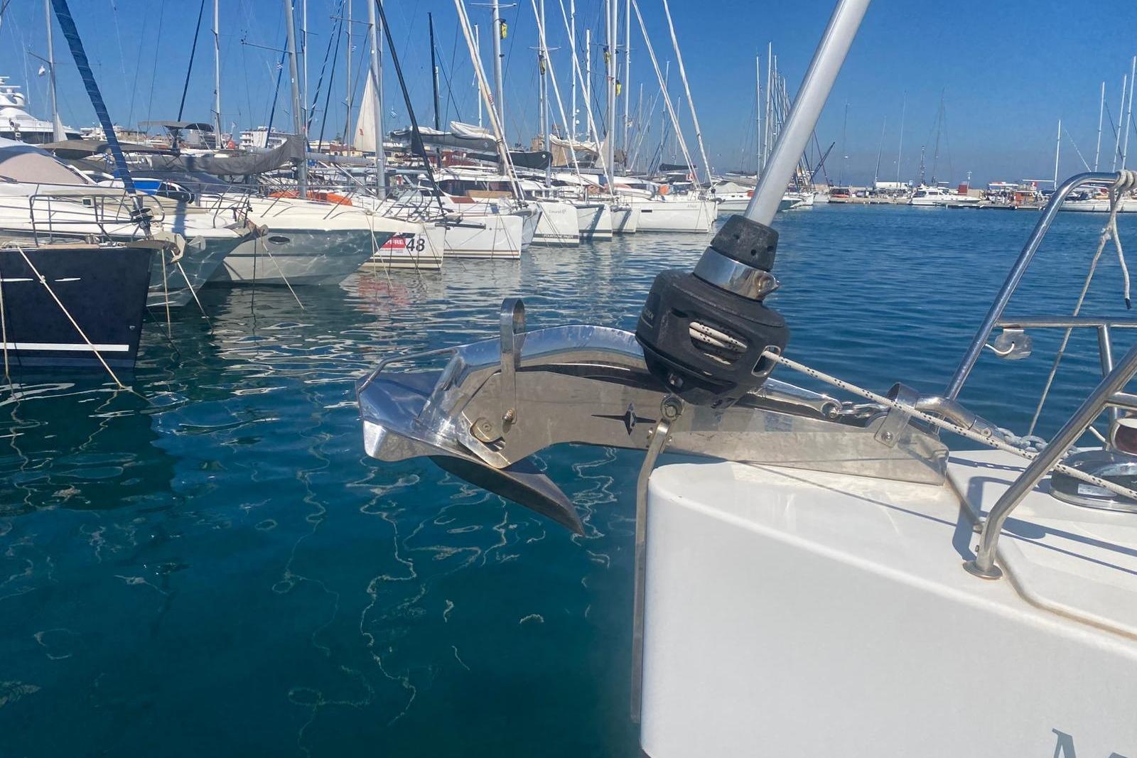 Sailboats docked in marina, featuring 2022 Bavaria C50 Style yacht.
