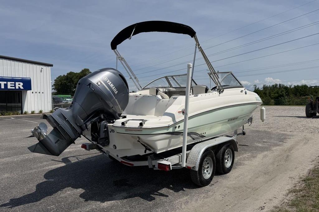 2019 Stingray 201 DS boat with Yamaha outboard motor on a trailer.