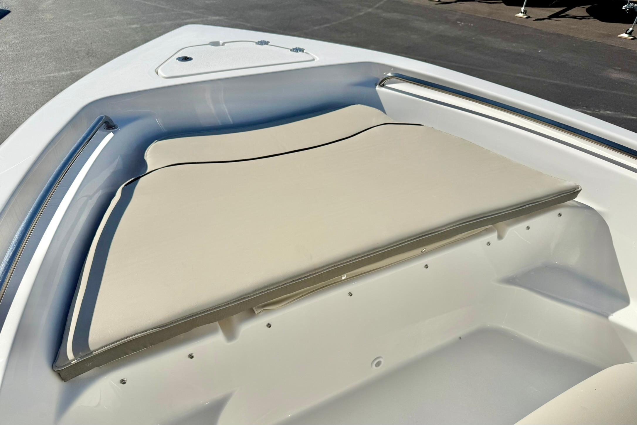 2026 Key West 189 FS boat bow with beige cushioned seating.