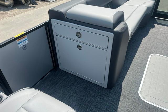 2026 Godfrey Sweetwater 2286 SBC boat interior with gray seating and storage compartments.
