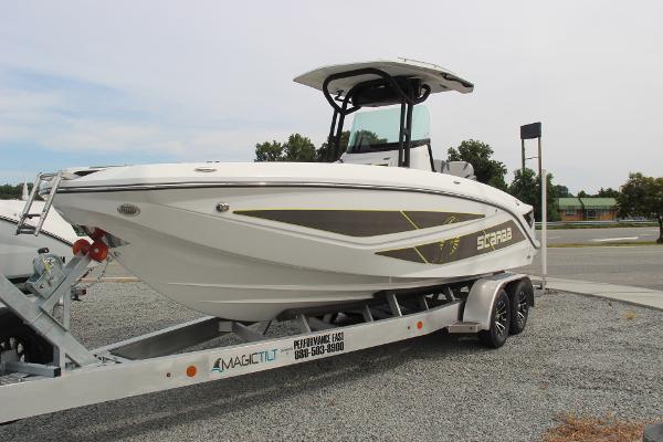 2023 Scarab 255 Open ID boat on trailer in parking lot.