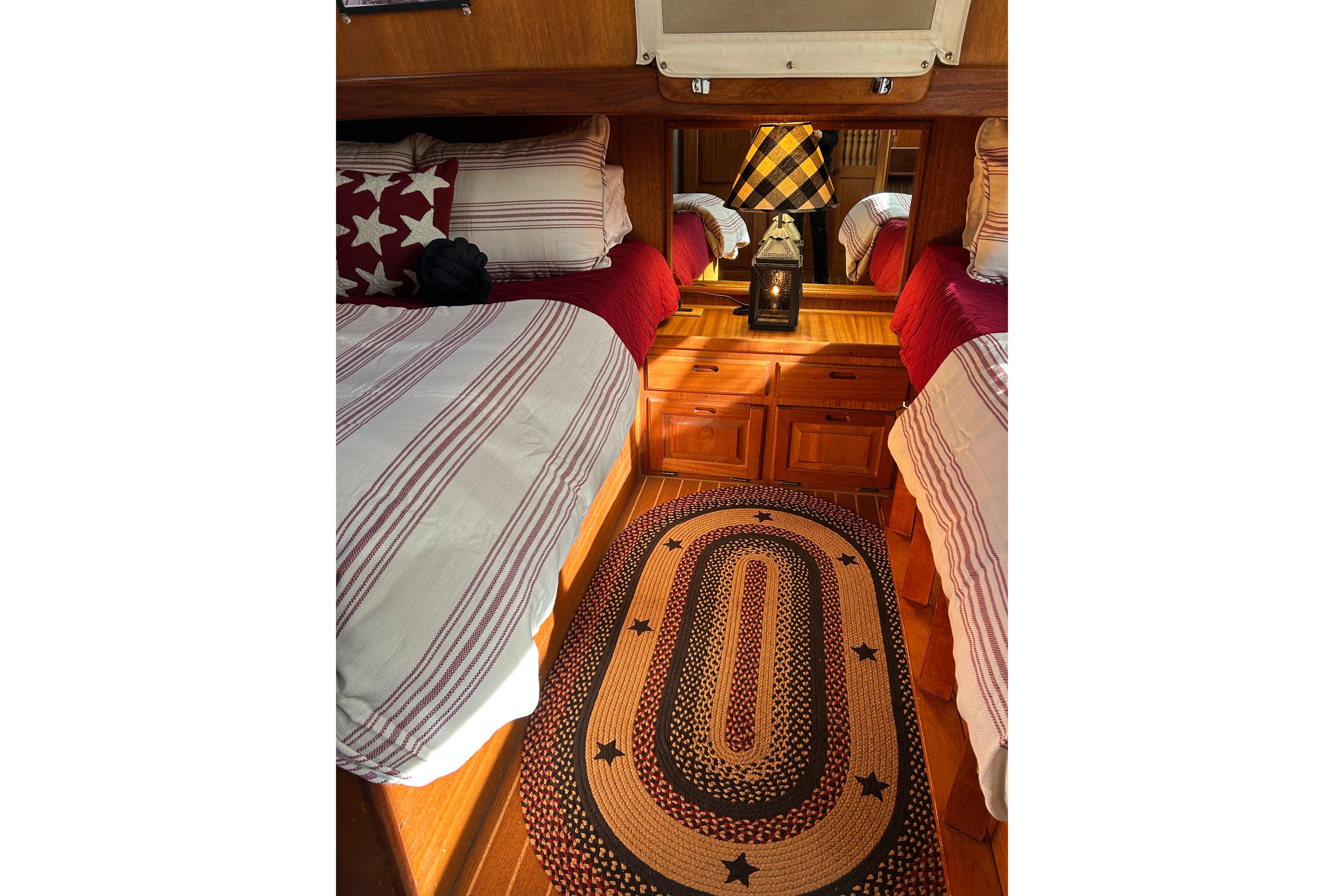 Cozy 1978 Californian 42 LRC cabin interior with twin beds and nautical decor.
