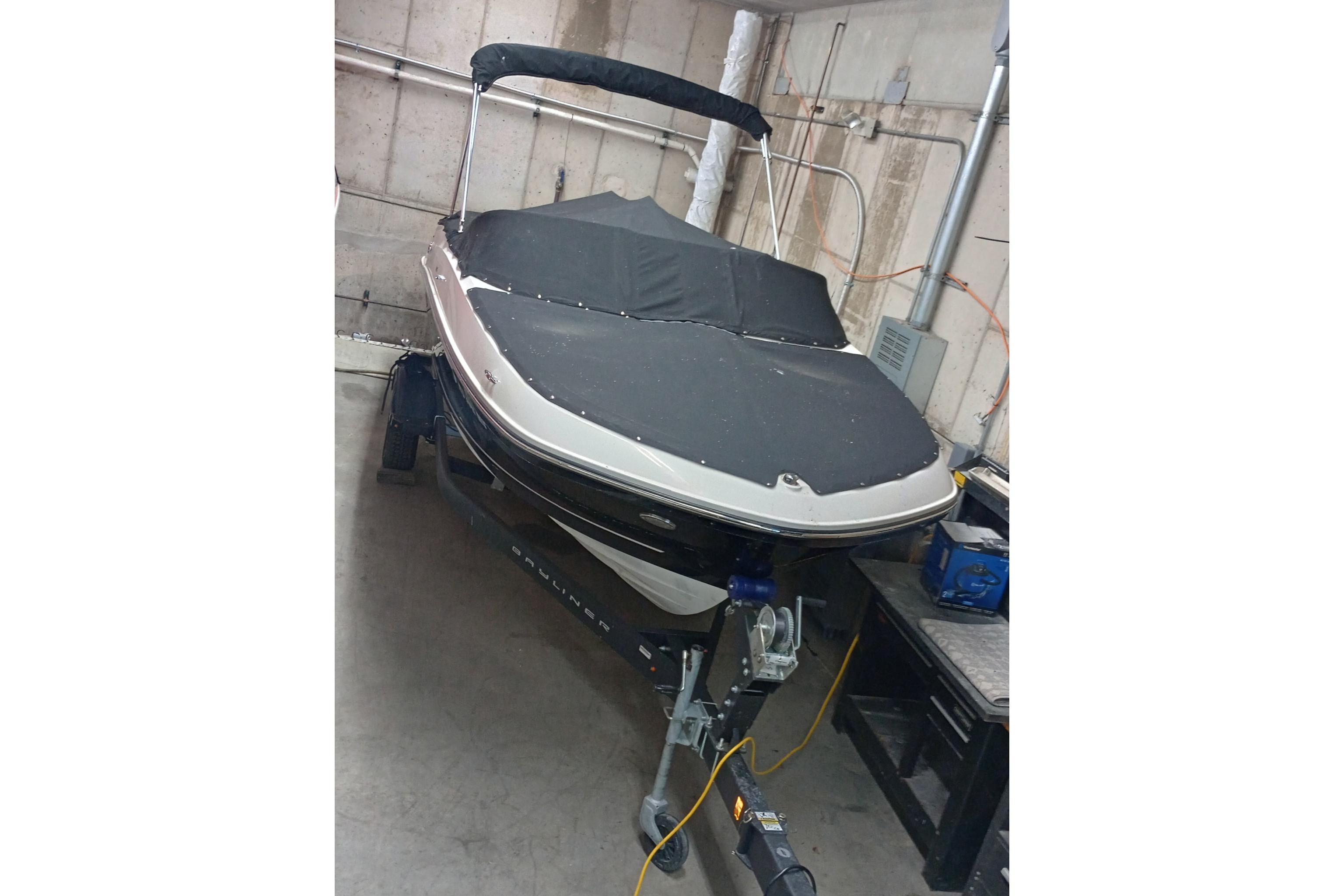 2022 Bayliner VR5 Bowrider I/O boat in storage, covered and on a trailer.