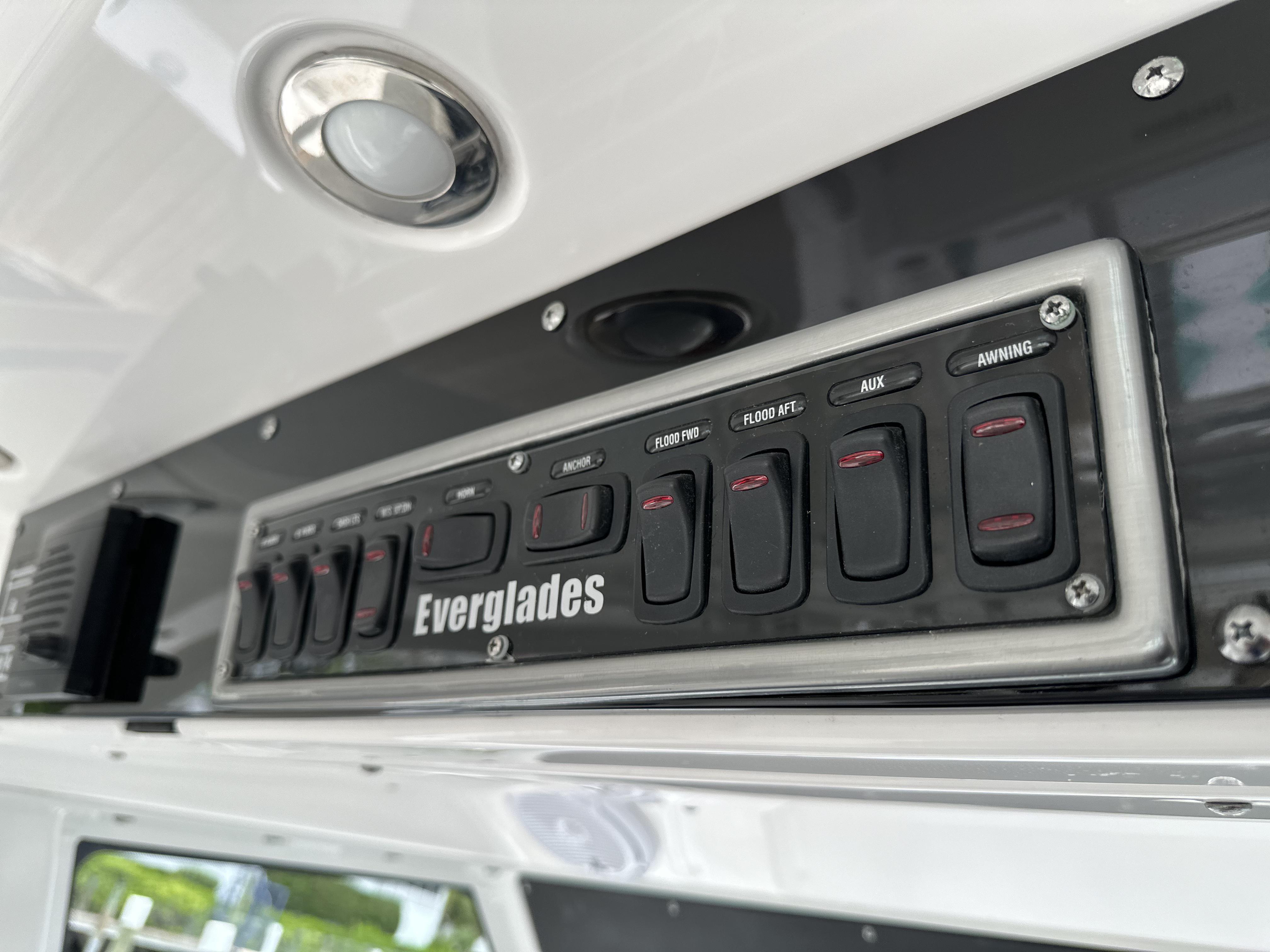 Control panel of 2017 Everglades 435 Center Console boat with labeled switches.