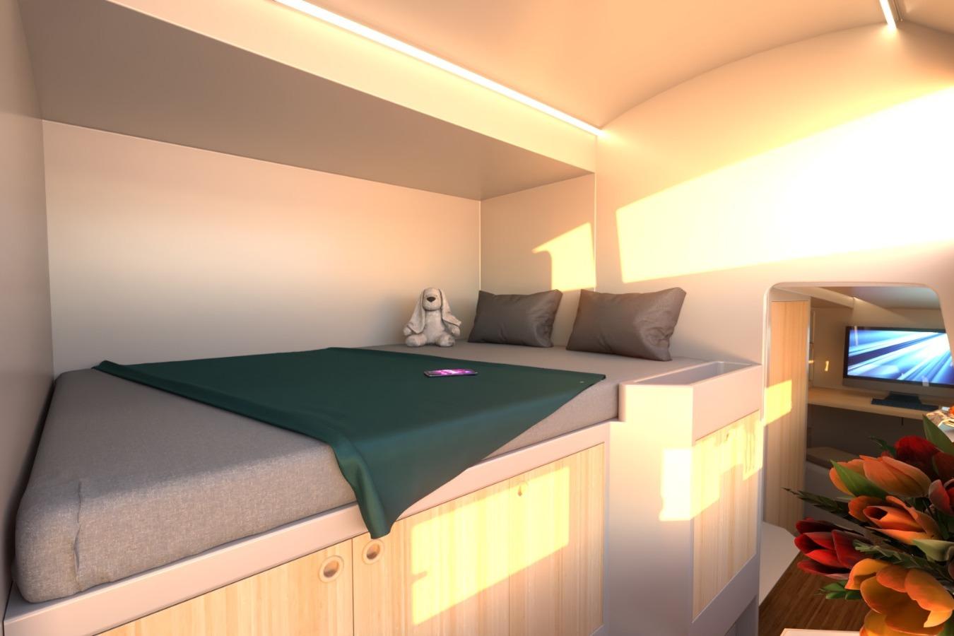Cozy cabin interior of 2026 Catamaran Cruisers Power Cat with bed and plush toy.