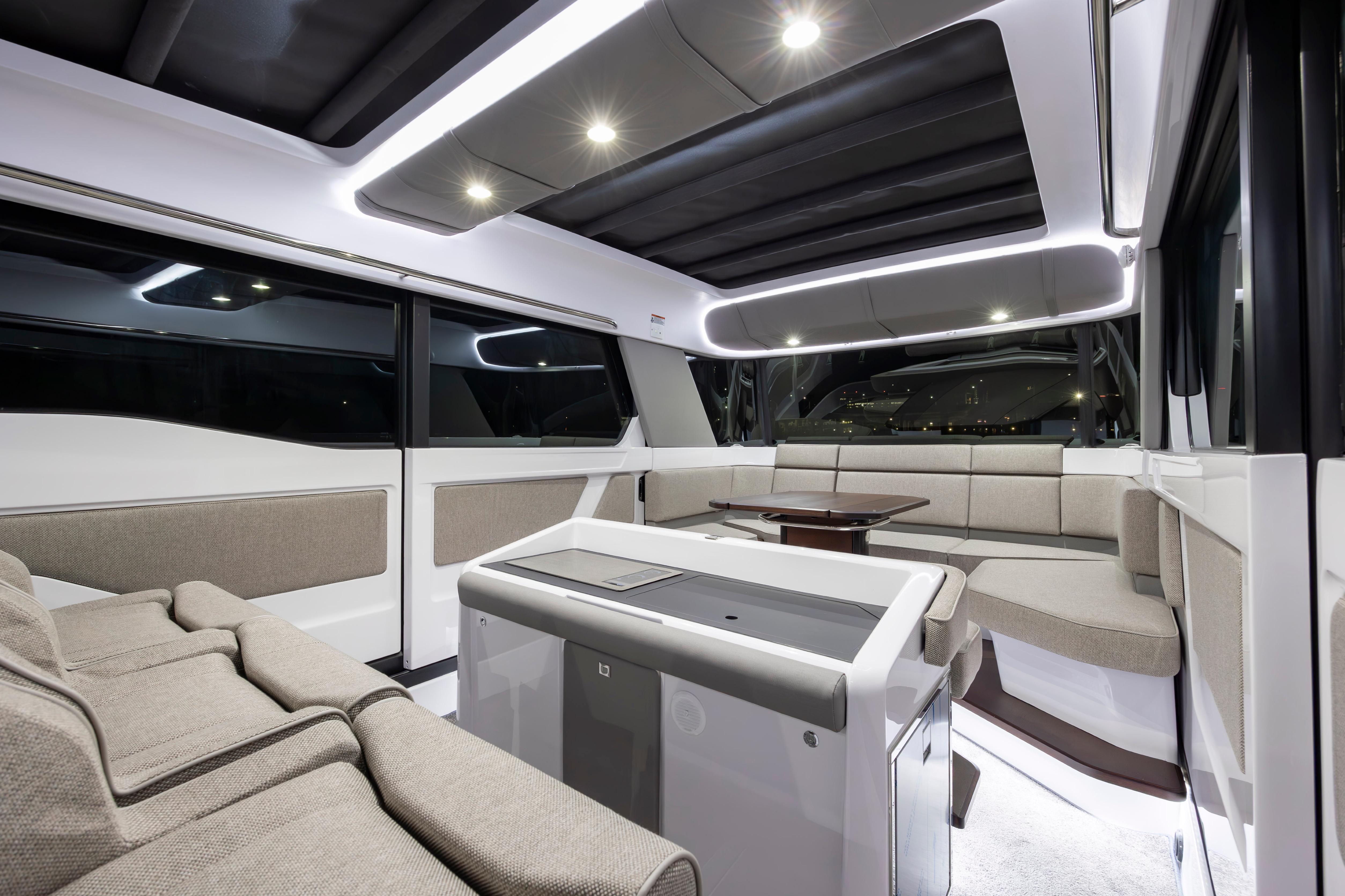 Luxurious interior of 2027 Axopar 45 XC Cross Cabin with modern seating and ambient lighting.