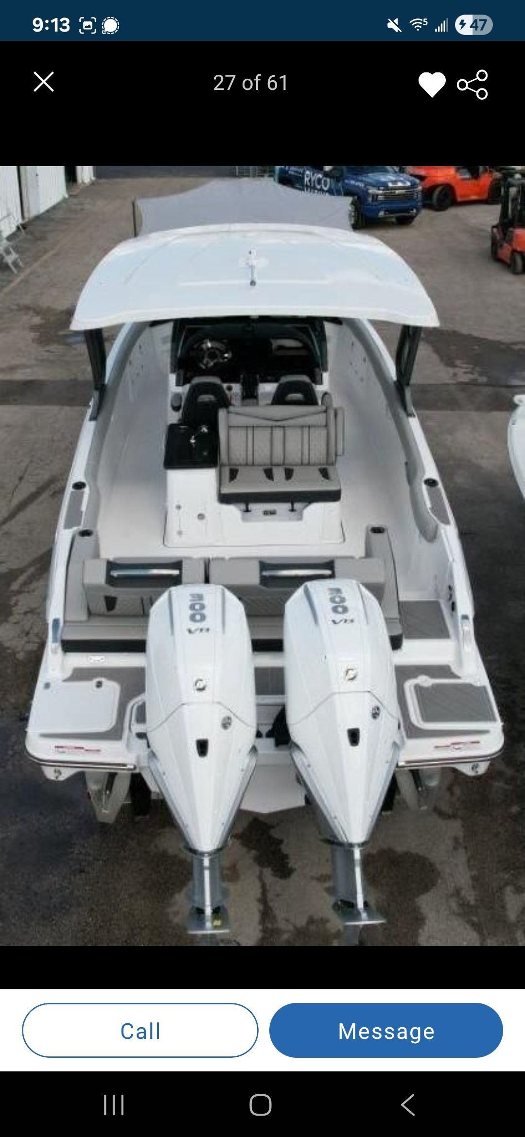 The image shows a modern boat with twin outboard engines and a spacious cockpit.