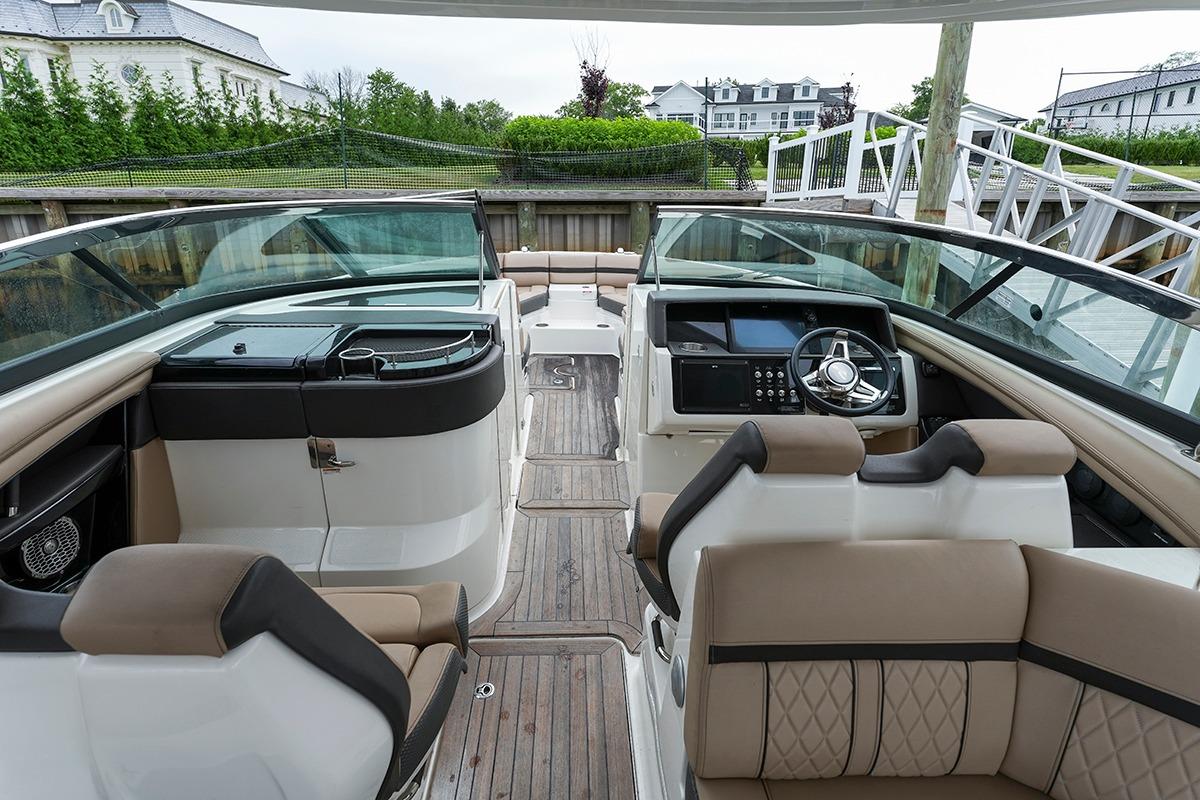 2018 Sea Ray SLX 350 boat interior with luxurious seating and modern dashboard.