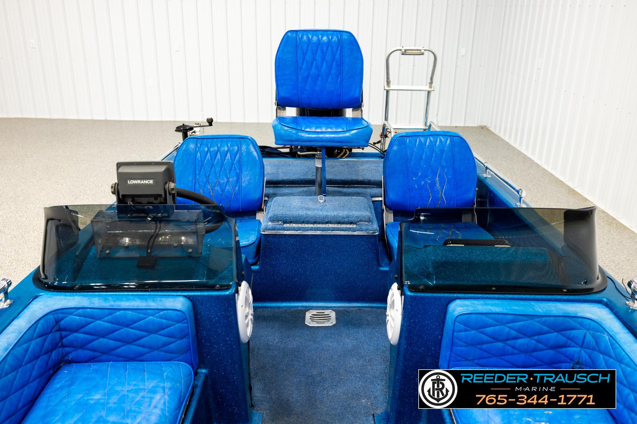 1980 Ranger 175 VS boat interior with blue seating and Lowrance equipment.