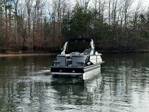 2025 Montara Surf Boss 2.0 25 boat cruising on a calm lake.