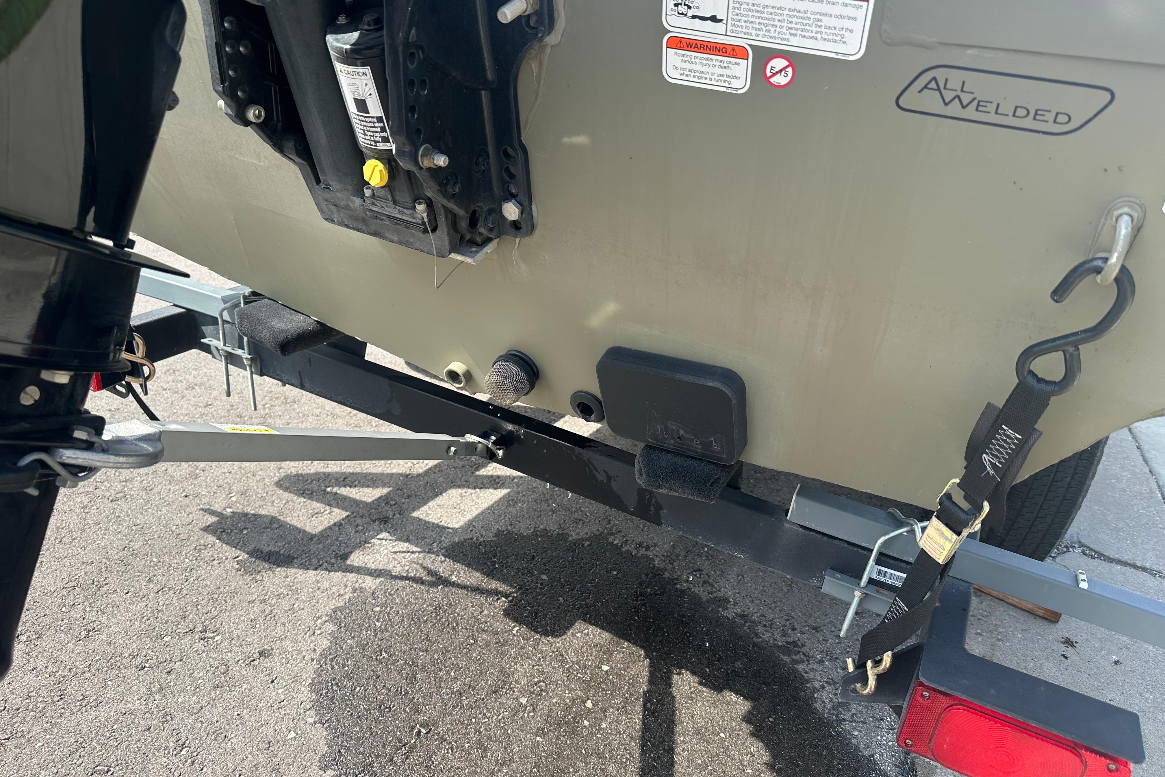 2024 Tracker Grizzly 1648 SC boat trailer hitch and rear view.