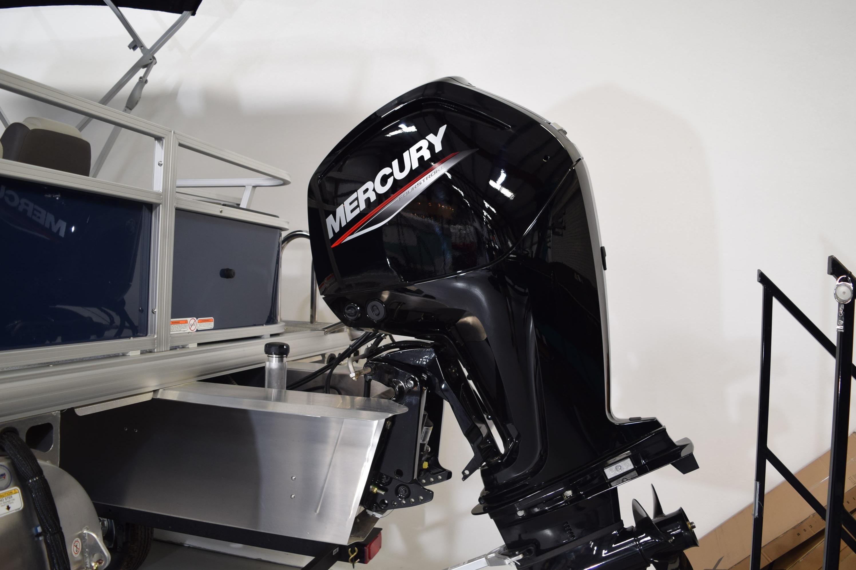 2026 Sun Tracker Bass Buggy 18 DLX with Mercury outboard motor, side view.