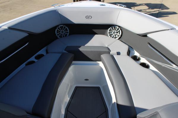 2025 Cobalt CS23 boat interior with gray seating and built-in speakers.