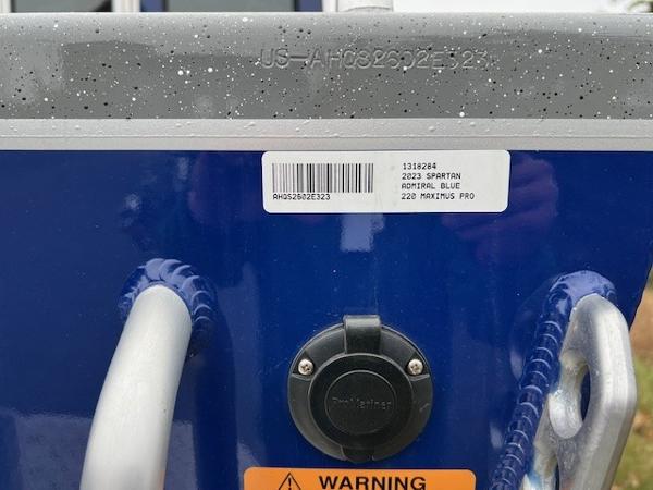 2023 Spartan 220 Maximus Pro, admiral blue, with warning label and barcode.