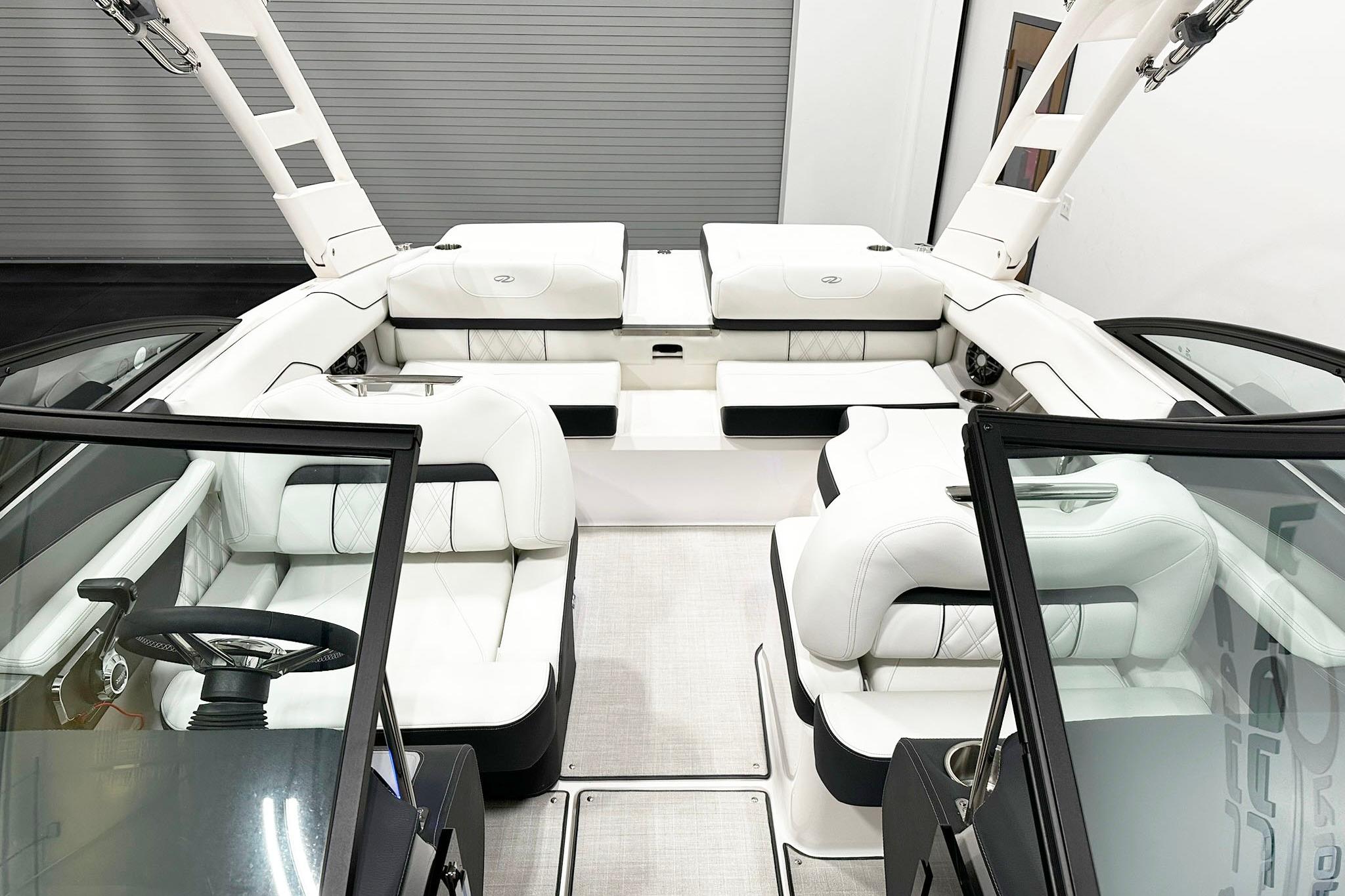 Luxurious interior of 2025 Regal LS2 boat with white seating and modern design.