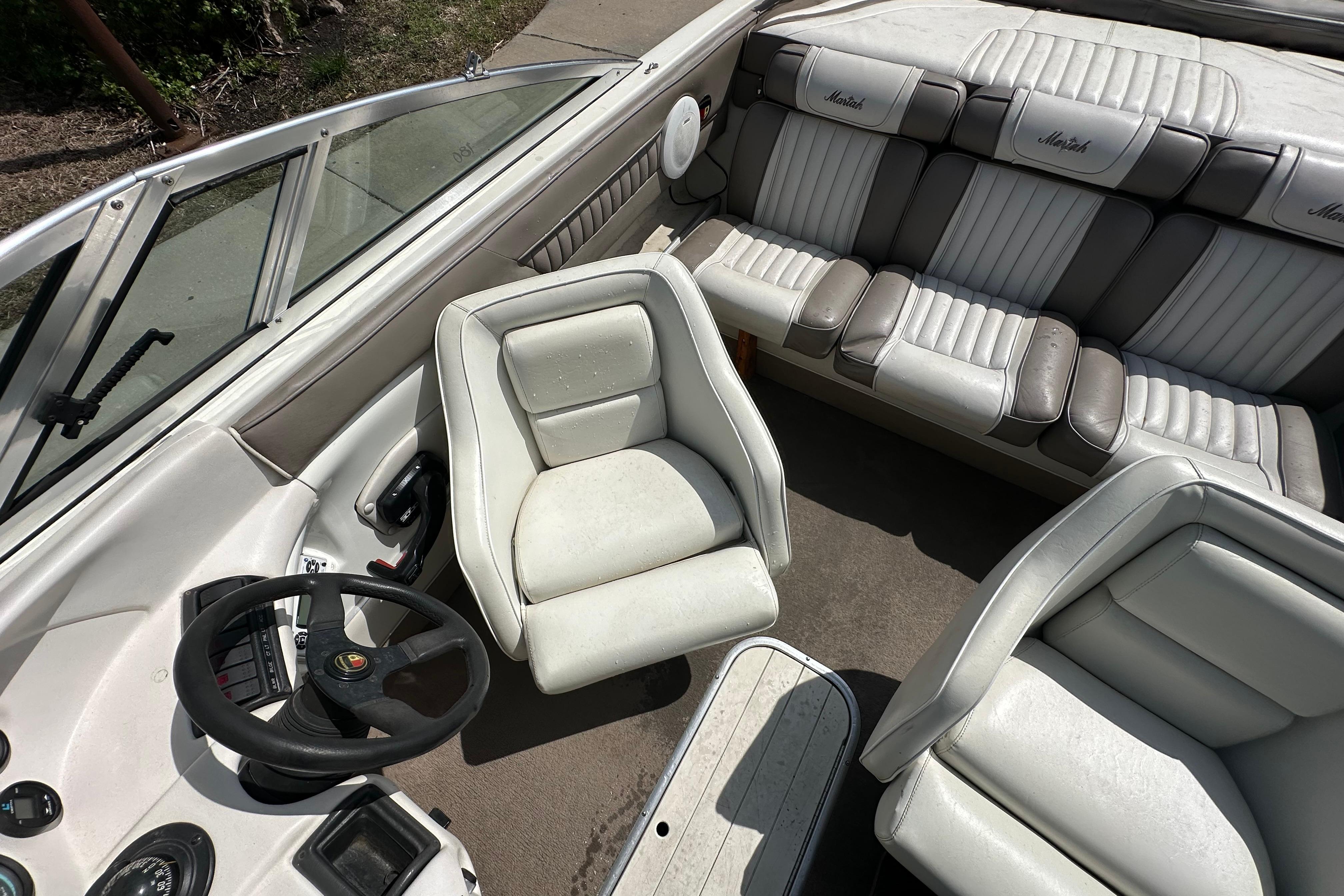 Interior of a 1995 Mariah 180 Shabah boat with white and gray seating.
