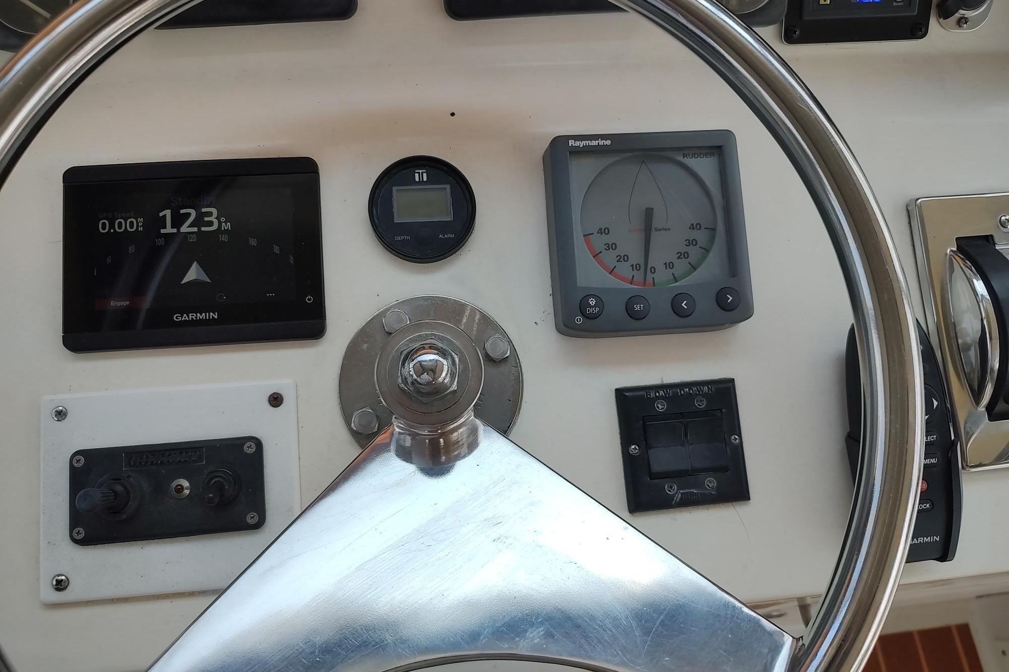 Steering wheel and navigation instruments on 1989 Hyatt Double Cabin Motoryacht.