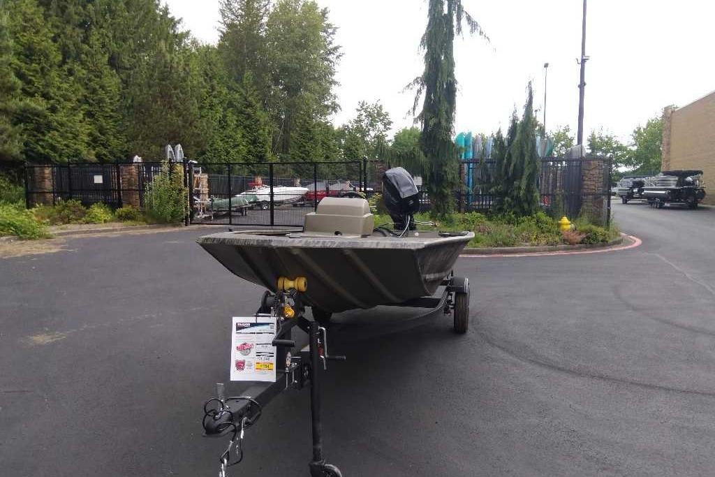 2026 Tracker Grizzly 1648 SC boat on trailer in outdoor setting.