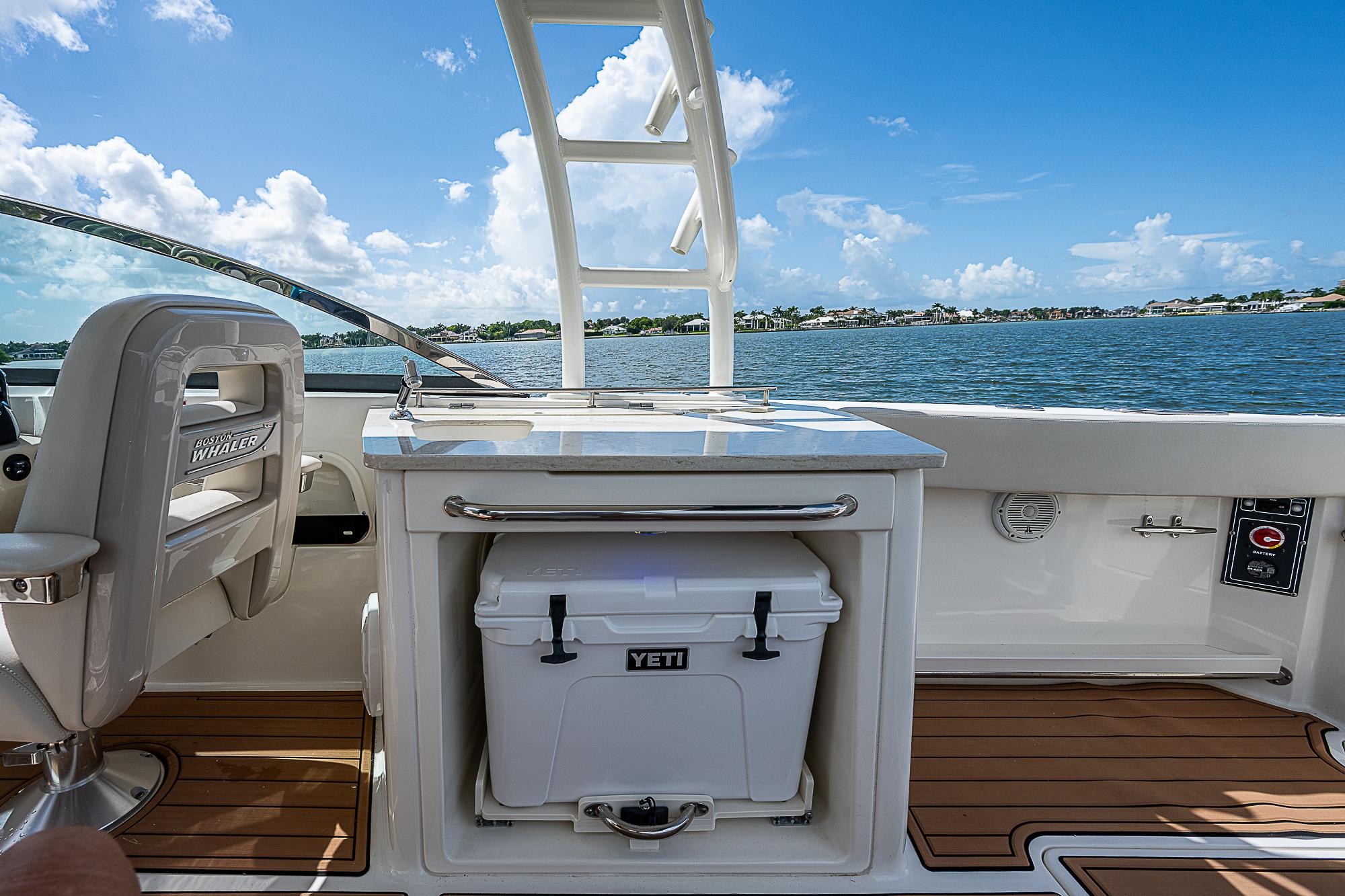 2018 Boston Whaler 270 Vantage boat interior with Yeti cooler and scenic water view.