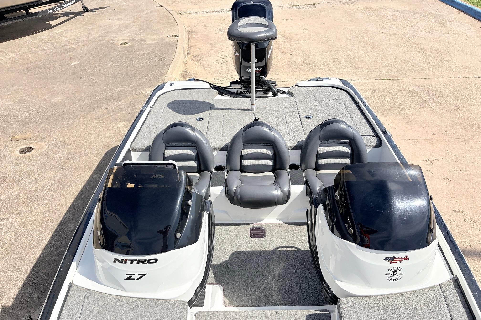 2011 Nitro Z-7 boat with dual seats and sleek design on concrete surface.