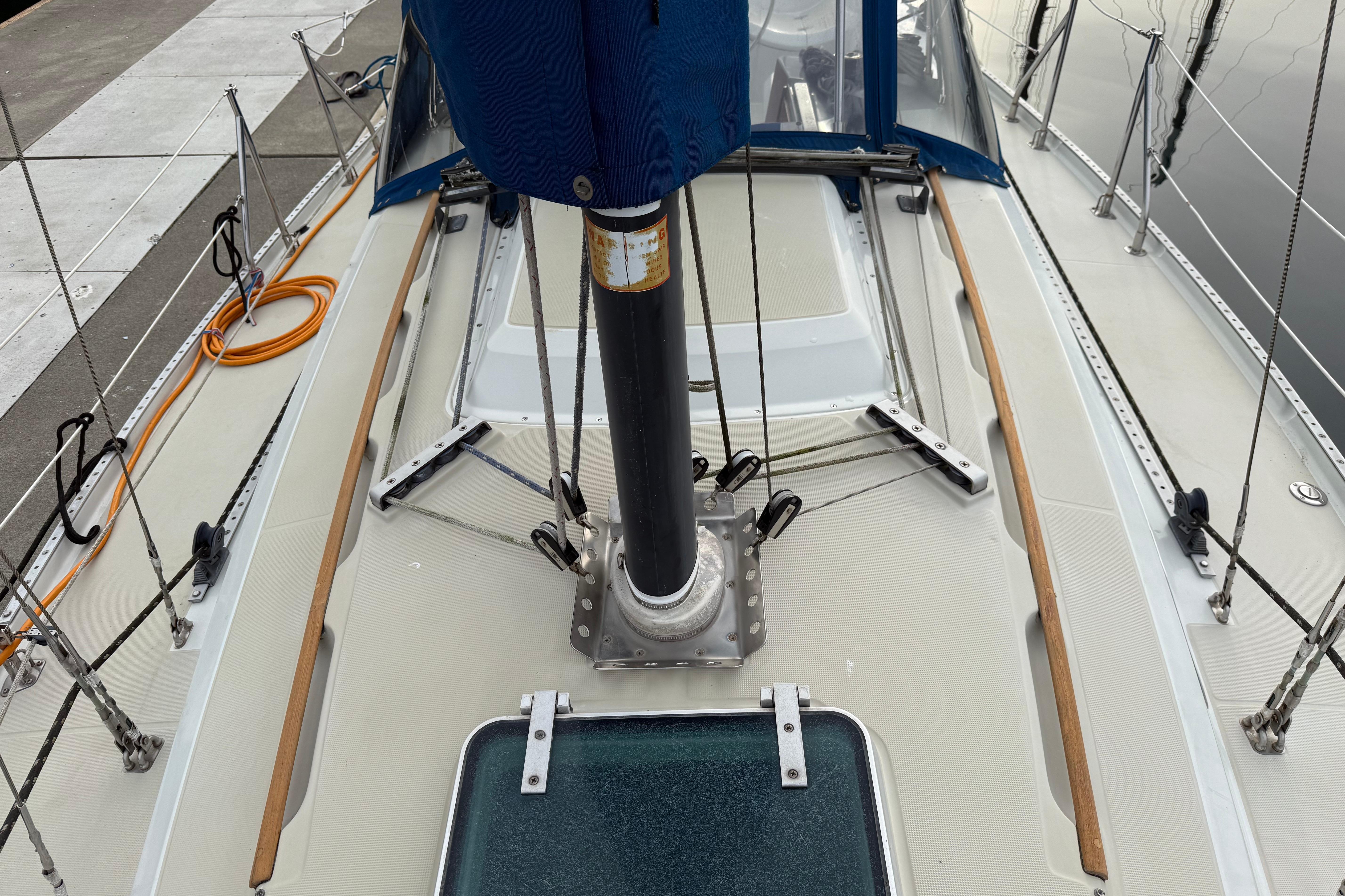 1988 Ericson 32-200 sailboat deck with rigging and dockside view.