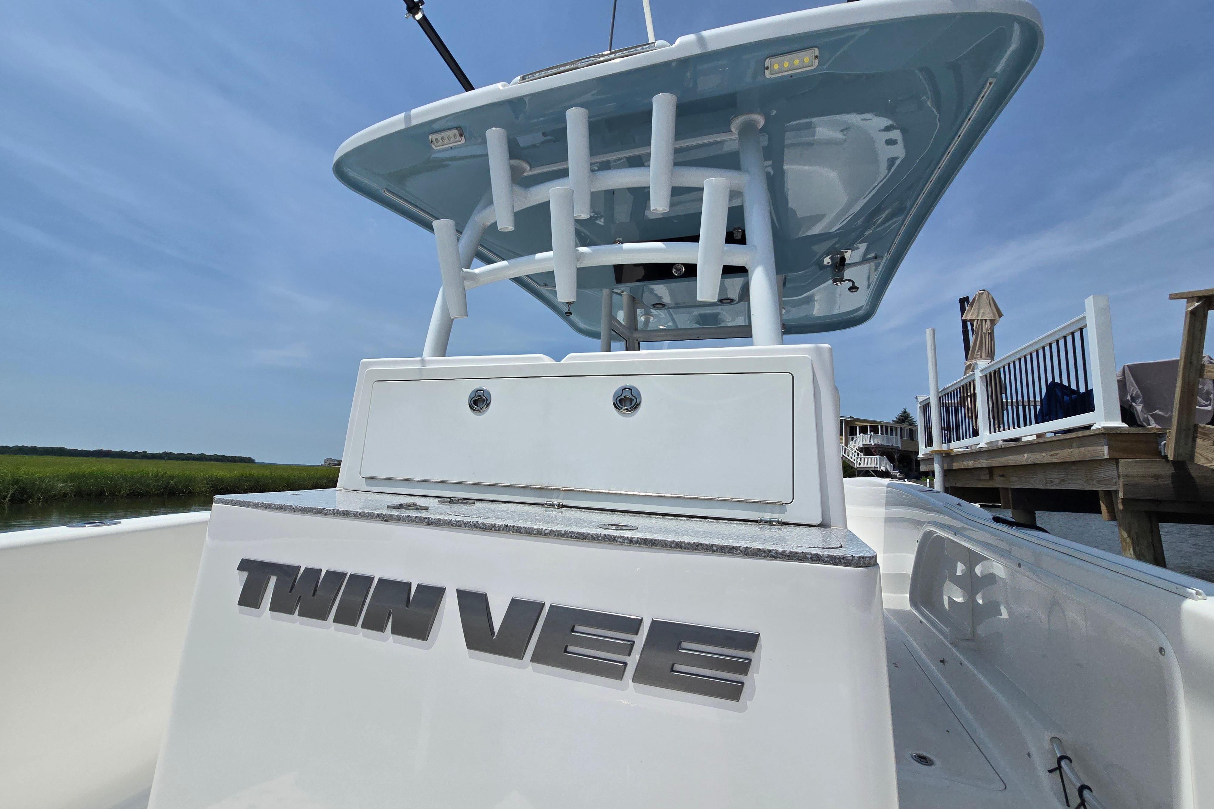 2021 Twin Vee 280 GFX CC boat docked, showcasing sleek design and spacious deck.