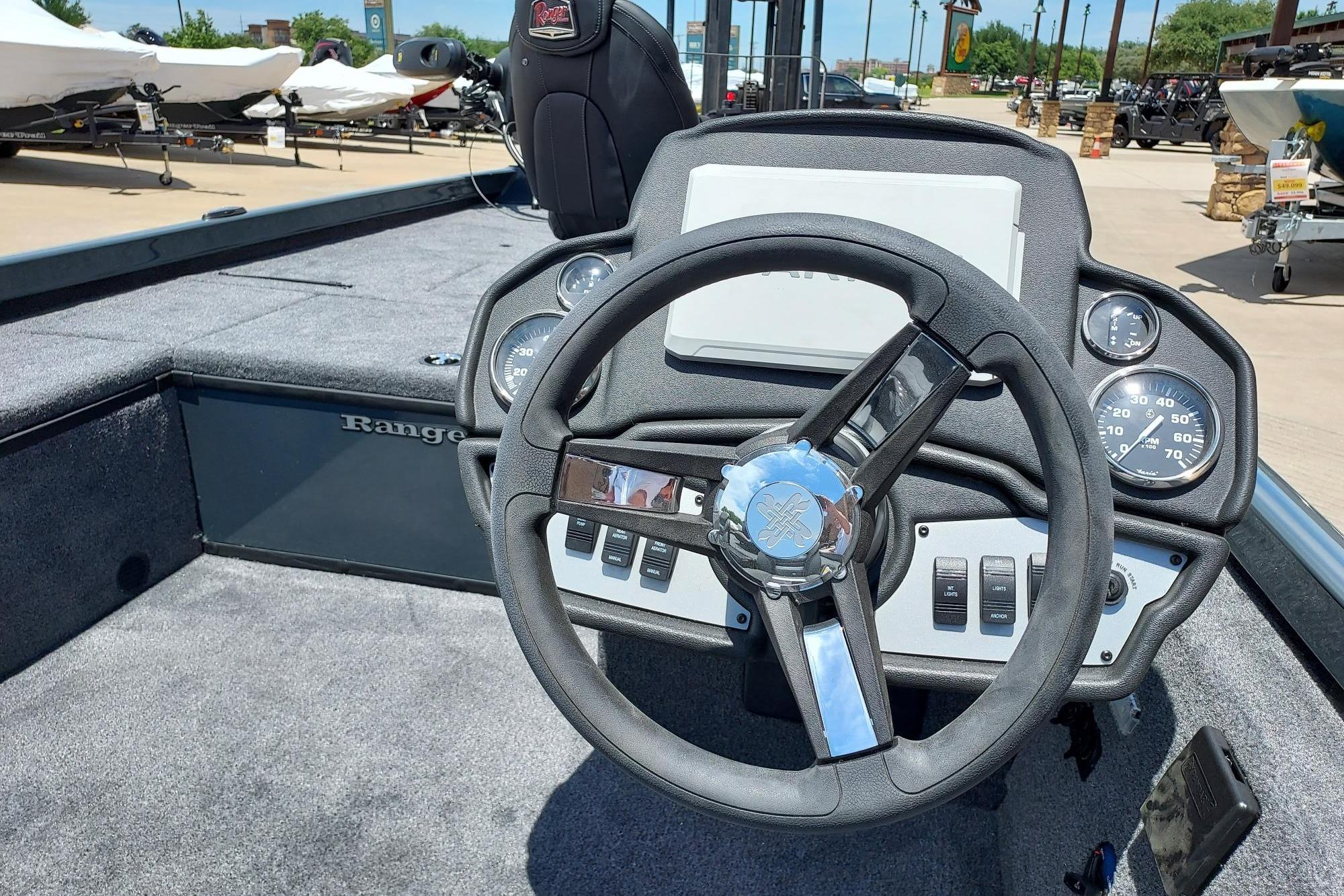 Cockpit view of 2026 Ranger RT188C boat with steering wheel and dashboard controls.