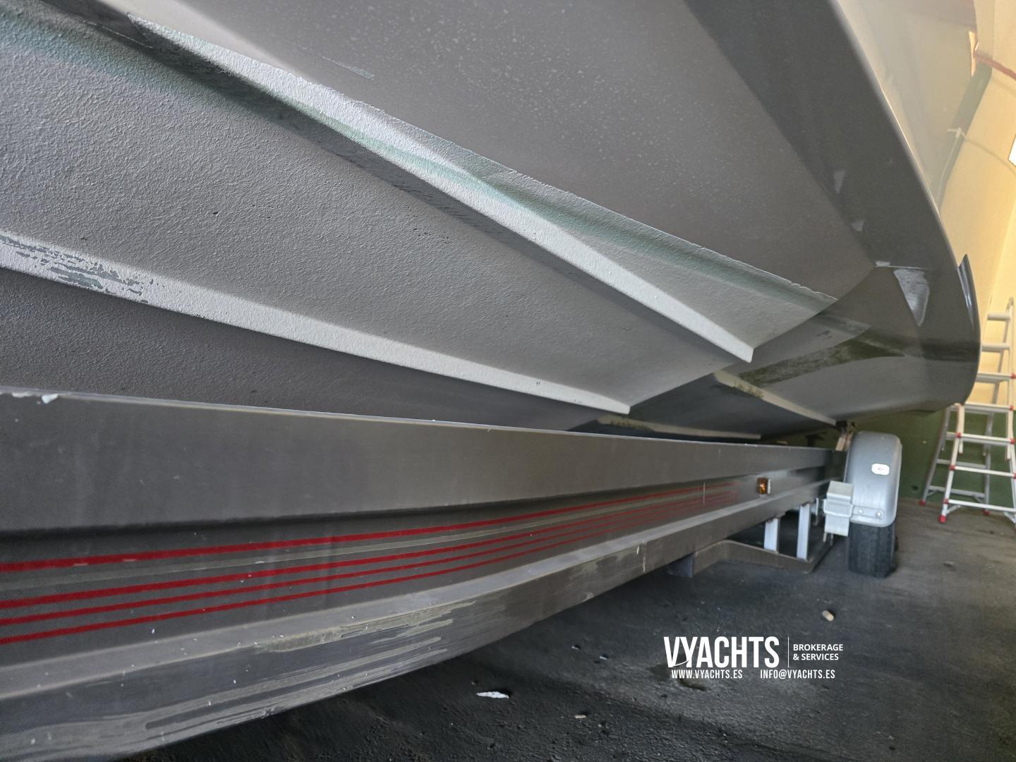 Underneath view of a 2011 Frauscher 1017 GT boat on a trailer.