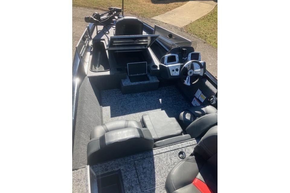 2026 Tracker Pro Team 175 boat interior with steering console and seating.