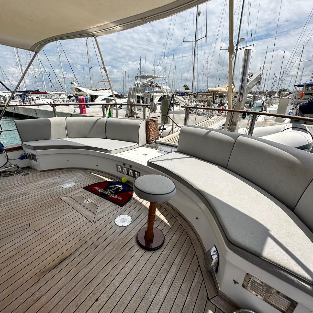 Spacious deck seating on 1994 Viking Marin Caicco yacht, docked at marina.
