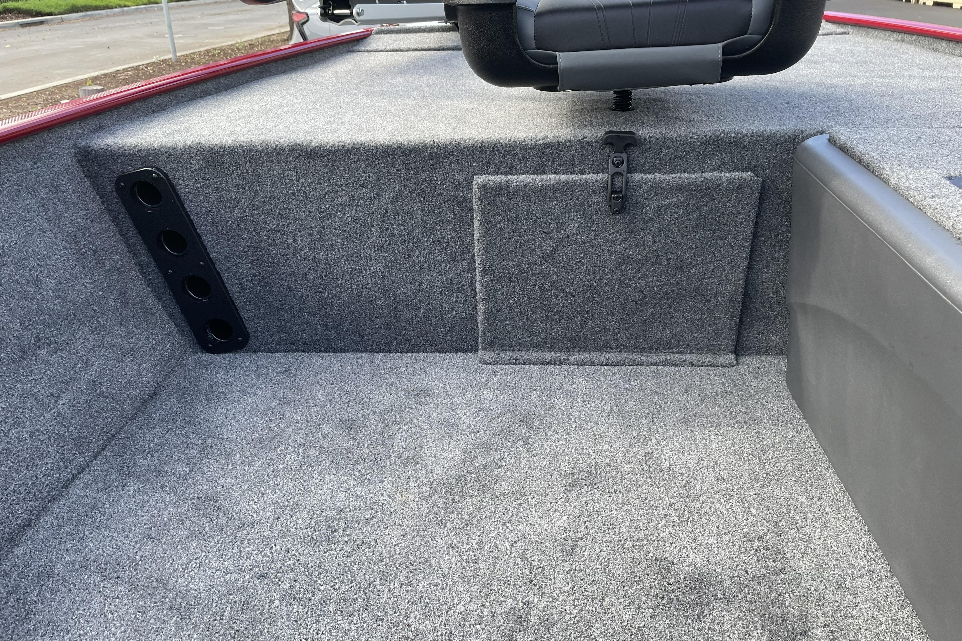 2026 Tracker Bass Tracker Classic XL boat interior with carpeted storage and seating.