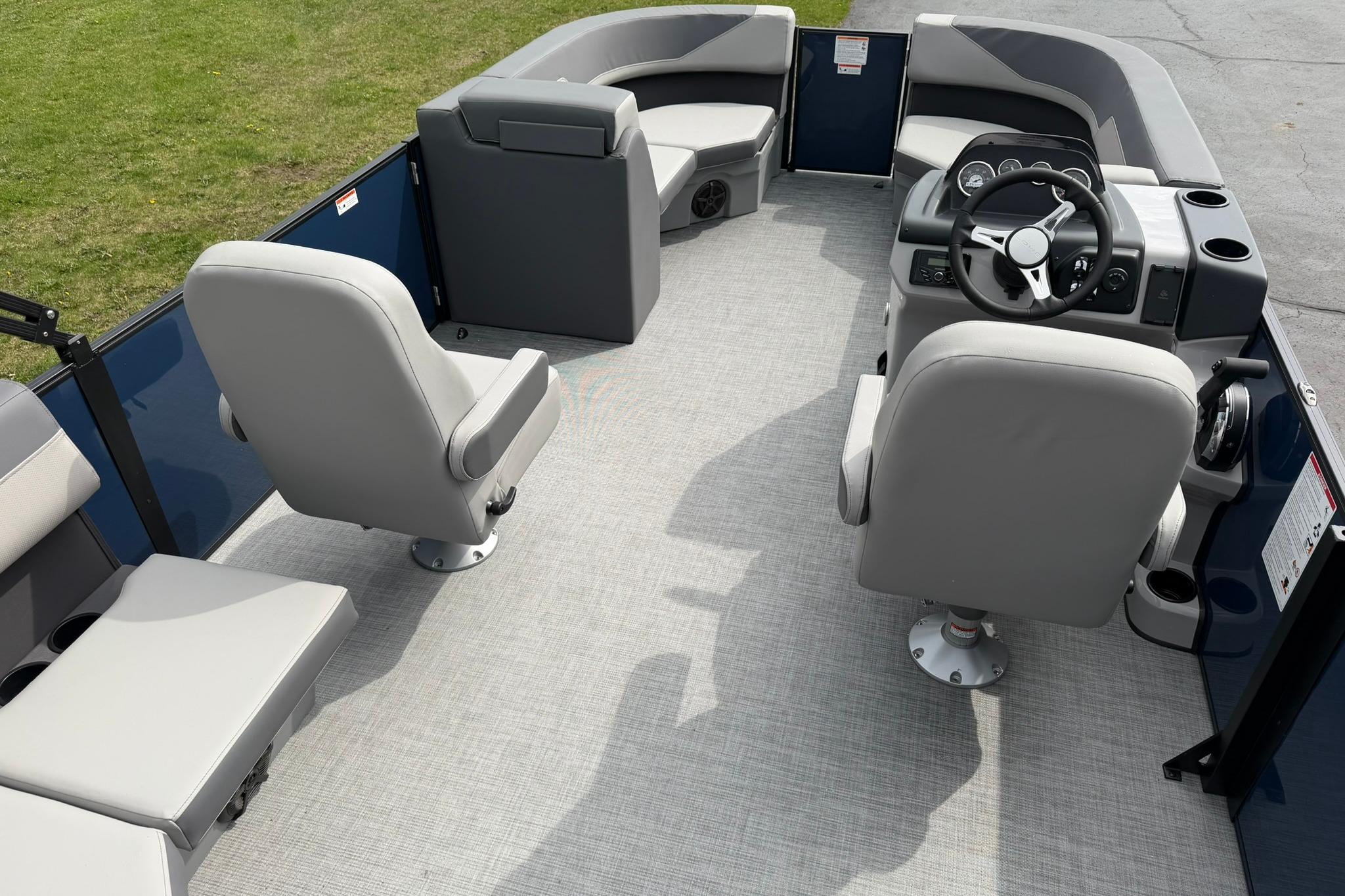 Interior of 2026 Lowe LS 190 pontoon boat with gray seating and steering console.