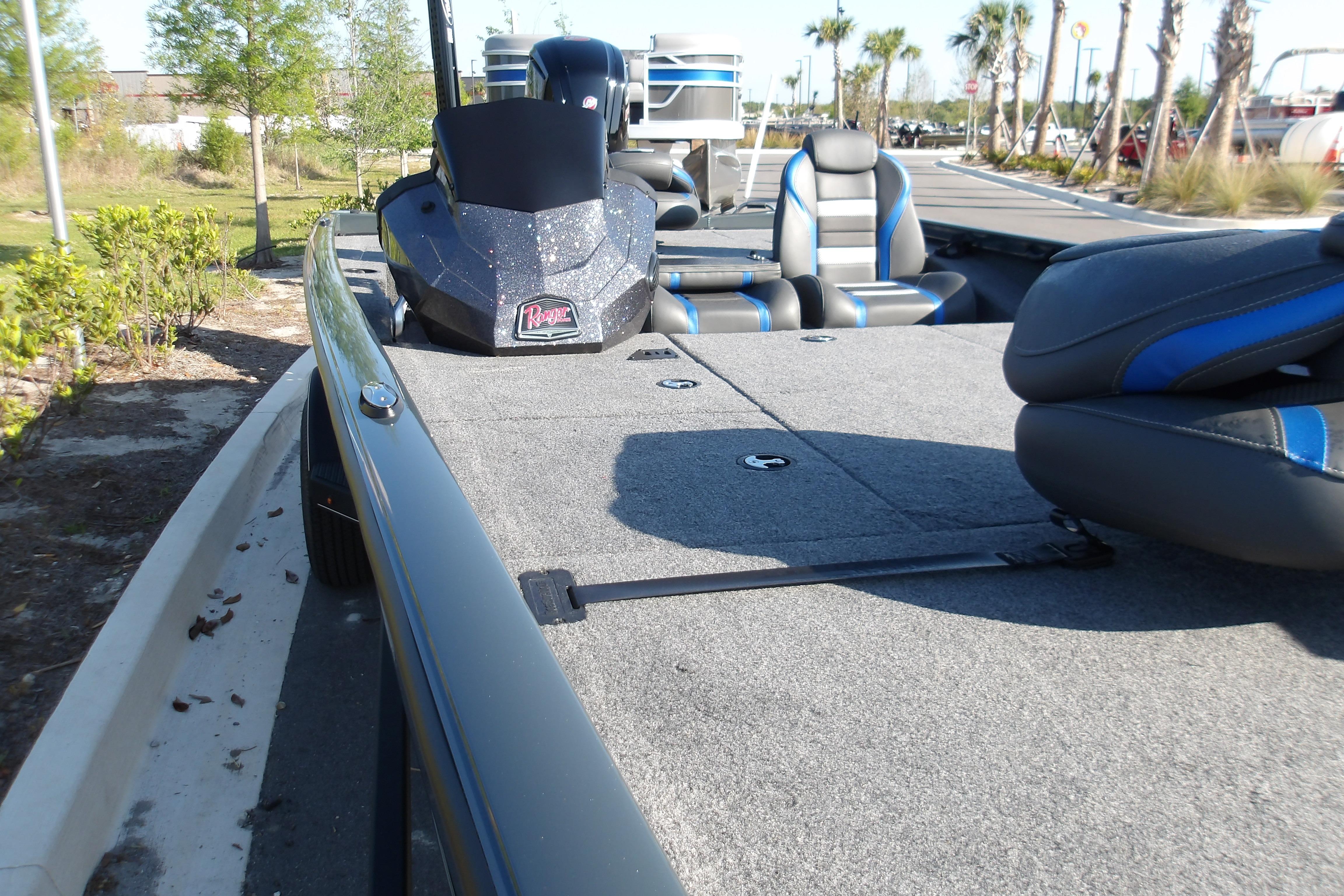 2024 Ranger RT188P boat with spacious deck and comfortable seating in outdoor setting.