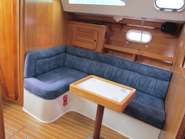 Interior of a 2000 Catalina 310 yacht with blue upholstery.