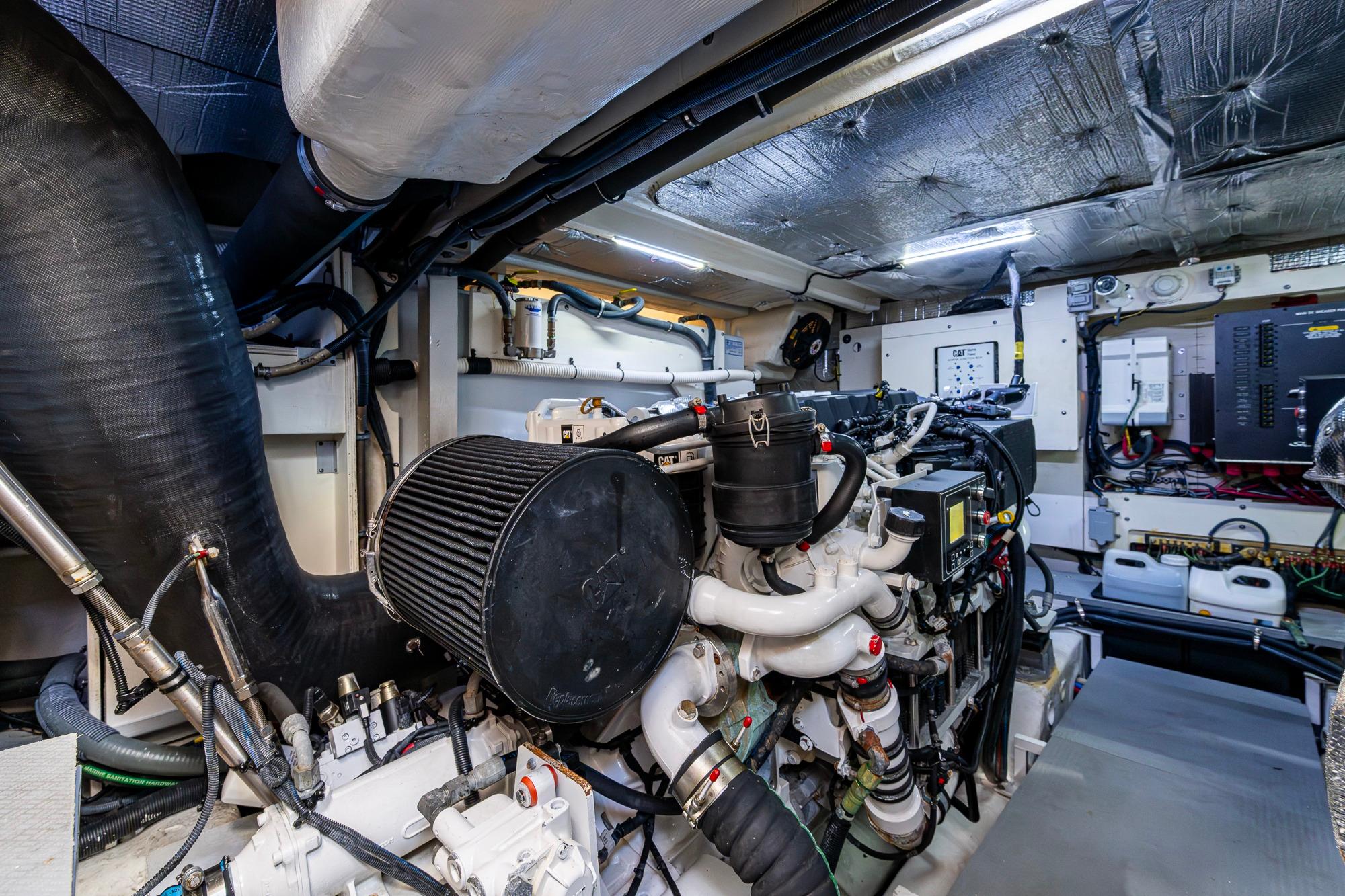 Engine room of 2018 Sea Ray L550 Fly yacht, showcasing complex machinery and components.