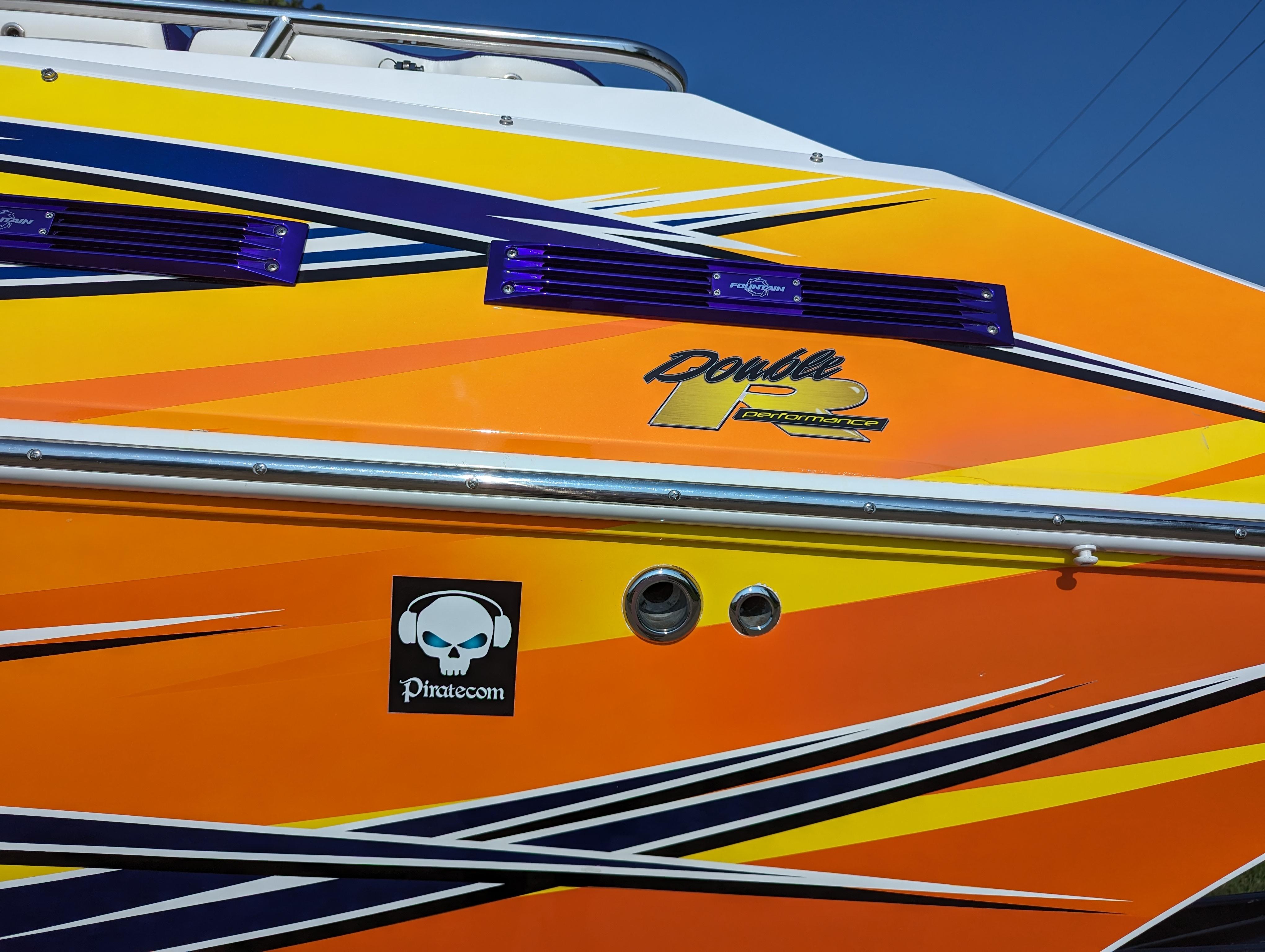 Colorful 2006 Fountain 42 boat with vibrant graphics and logo.