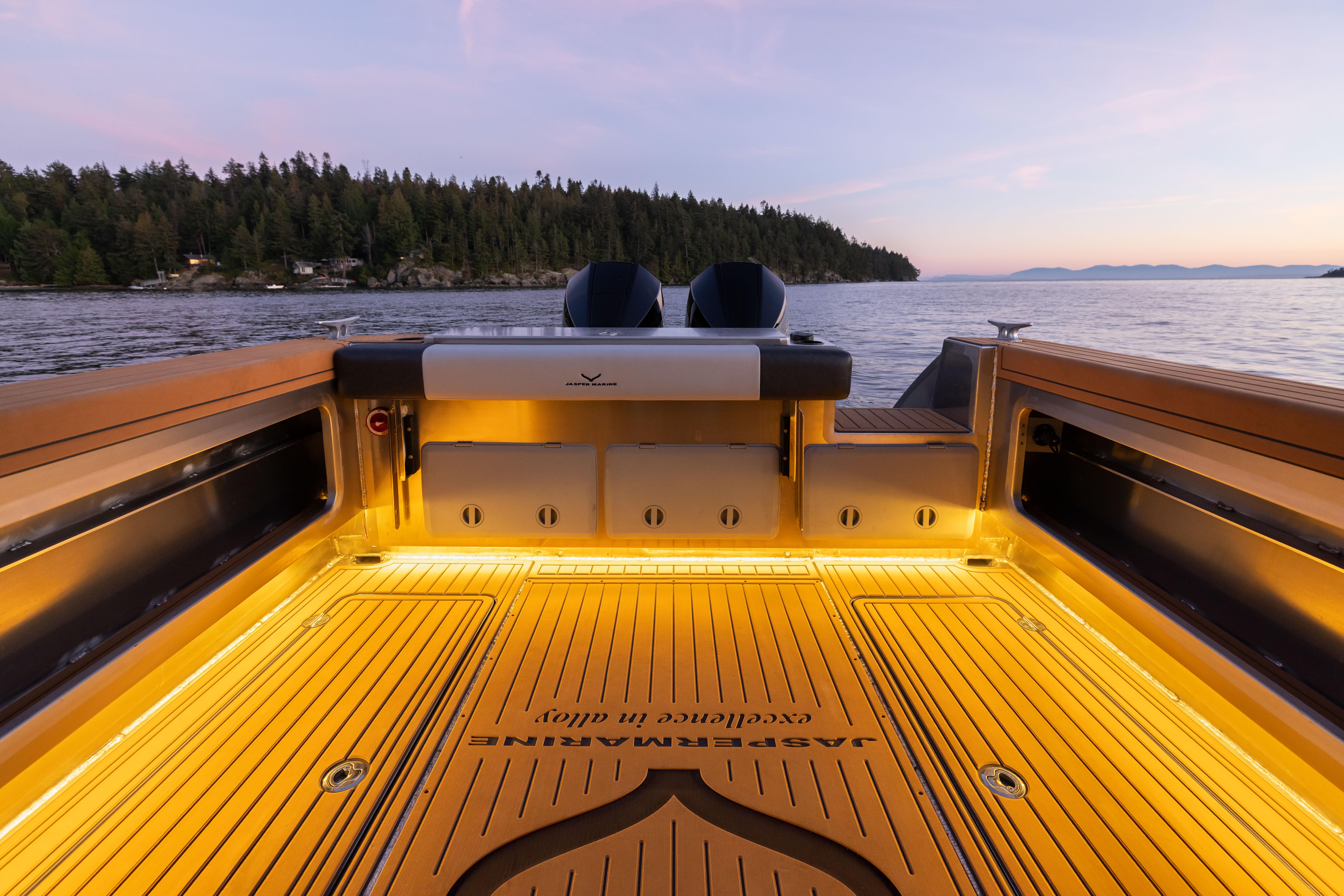 2025 Jasper Marine Defender 22 boat interior with scenic ocean view at sunset.