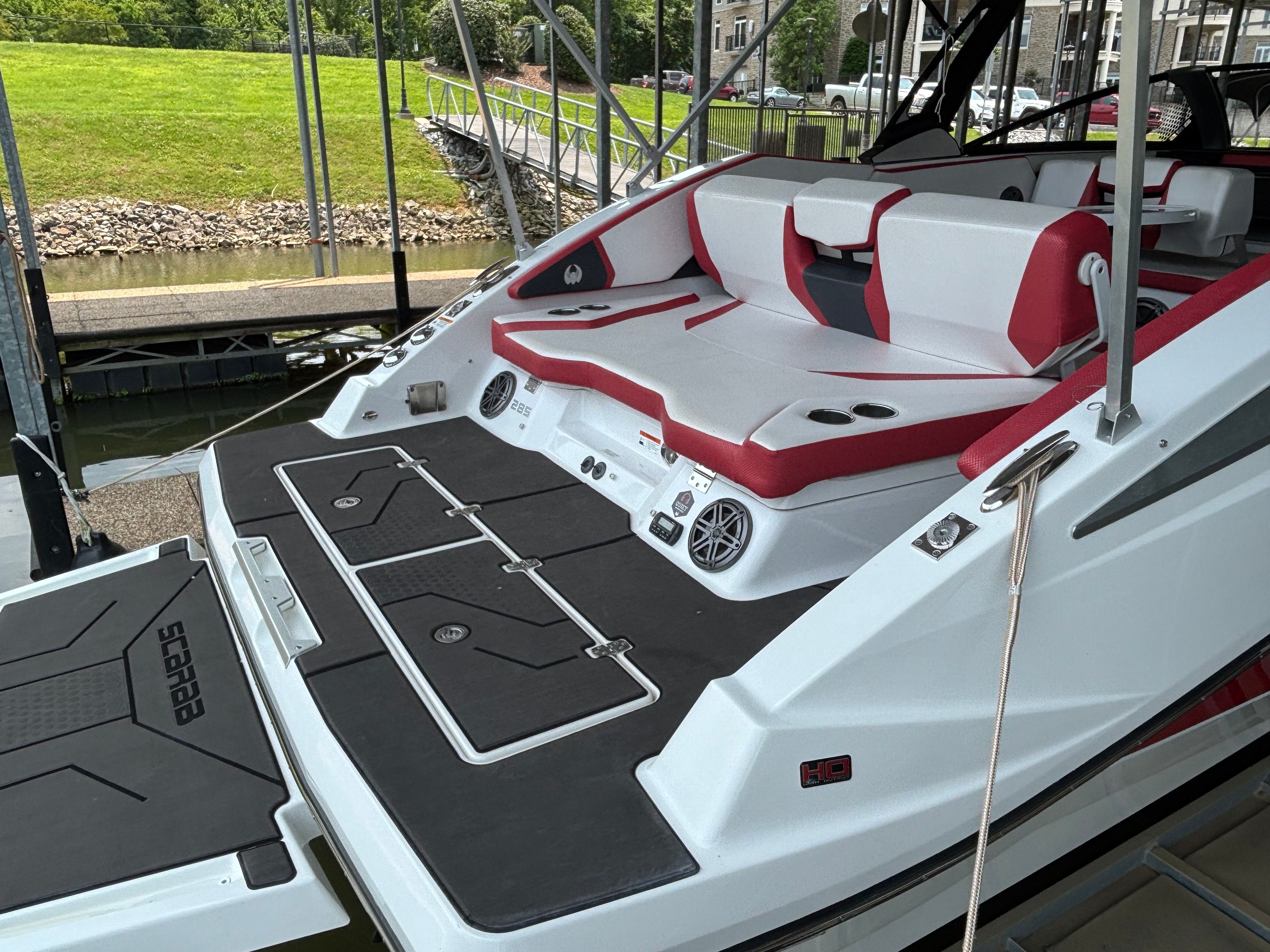 2021 Scarab 285 ID boat at dock with luxurious interior.