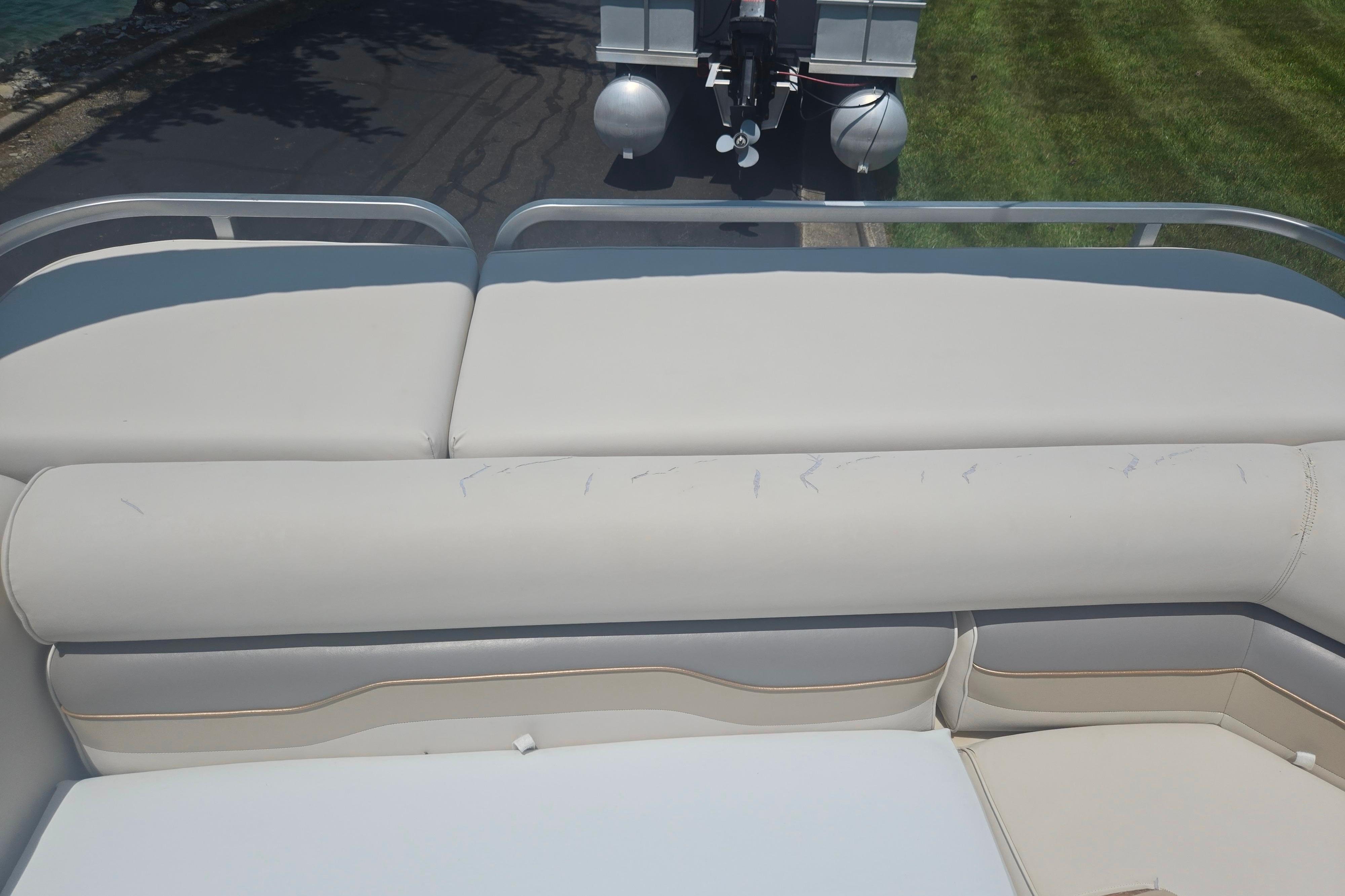 Rear seating area of a 2000 Sylvan 824 Elite Cruise boat, showing light wear.