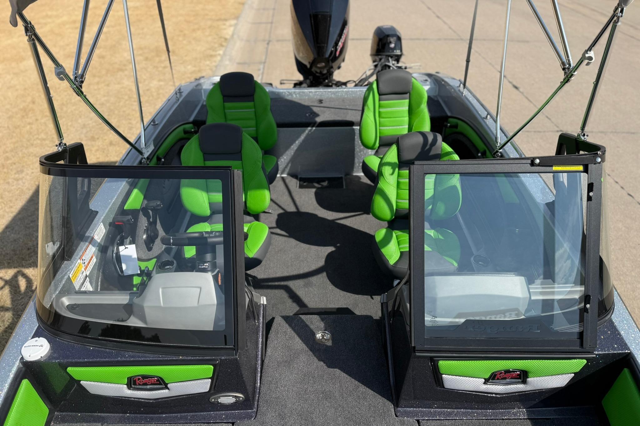 2026 Ranger 1880MS boat interior with green seats and dual windshields.