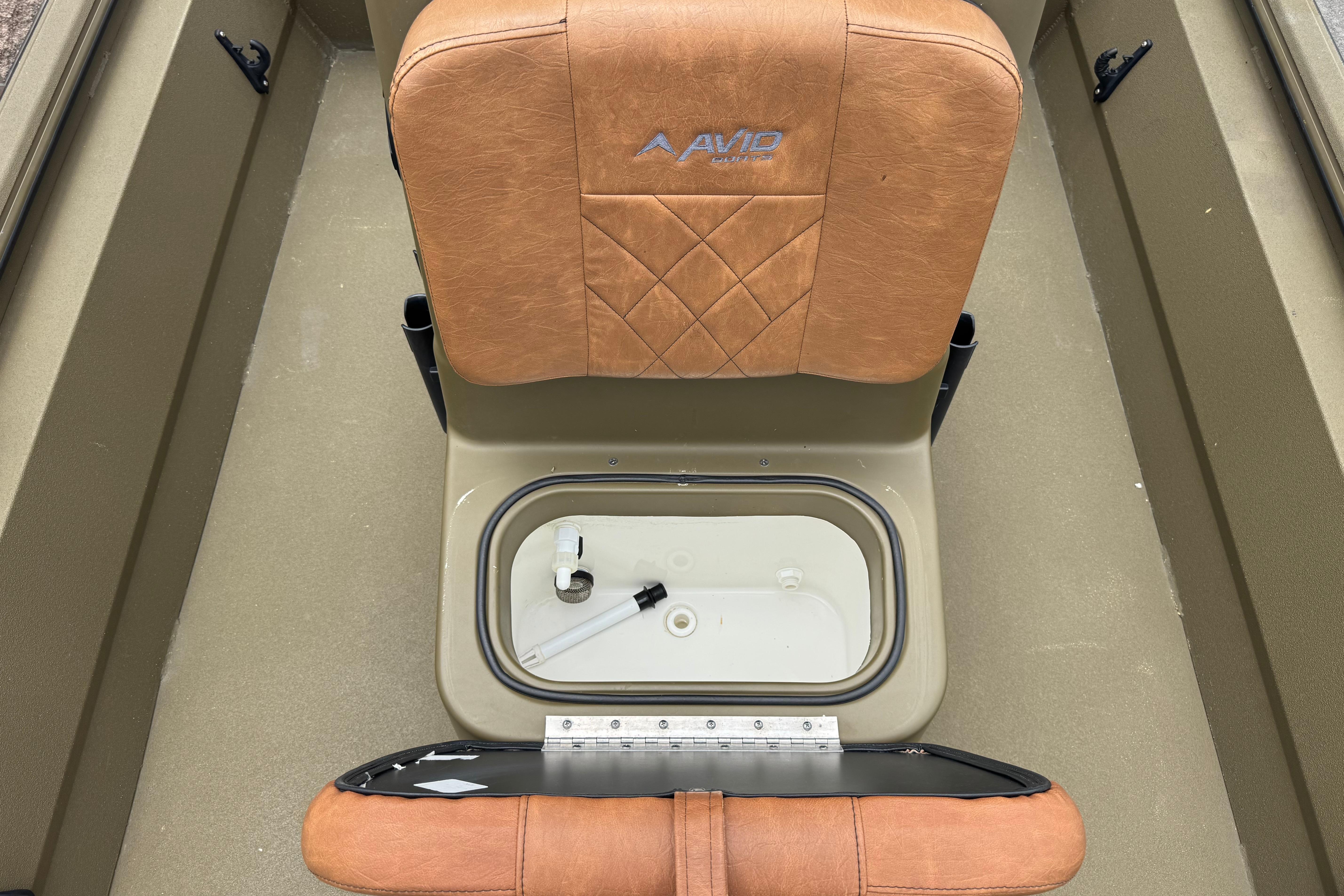 2023 Avid 18 Rogue CC boat seat with storage compartment, tan upholstery.