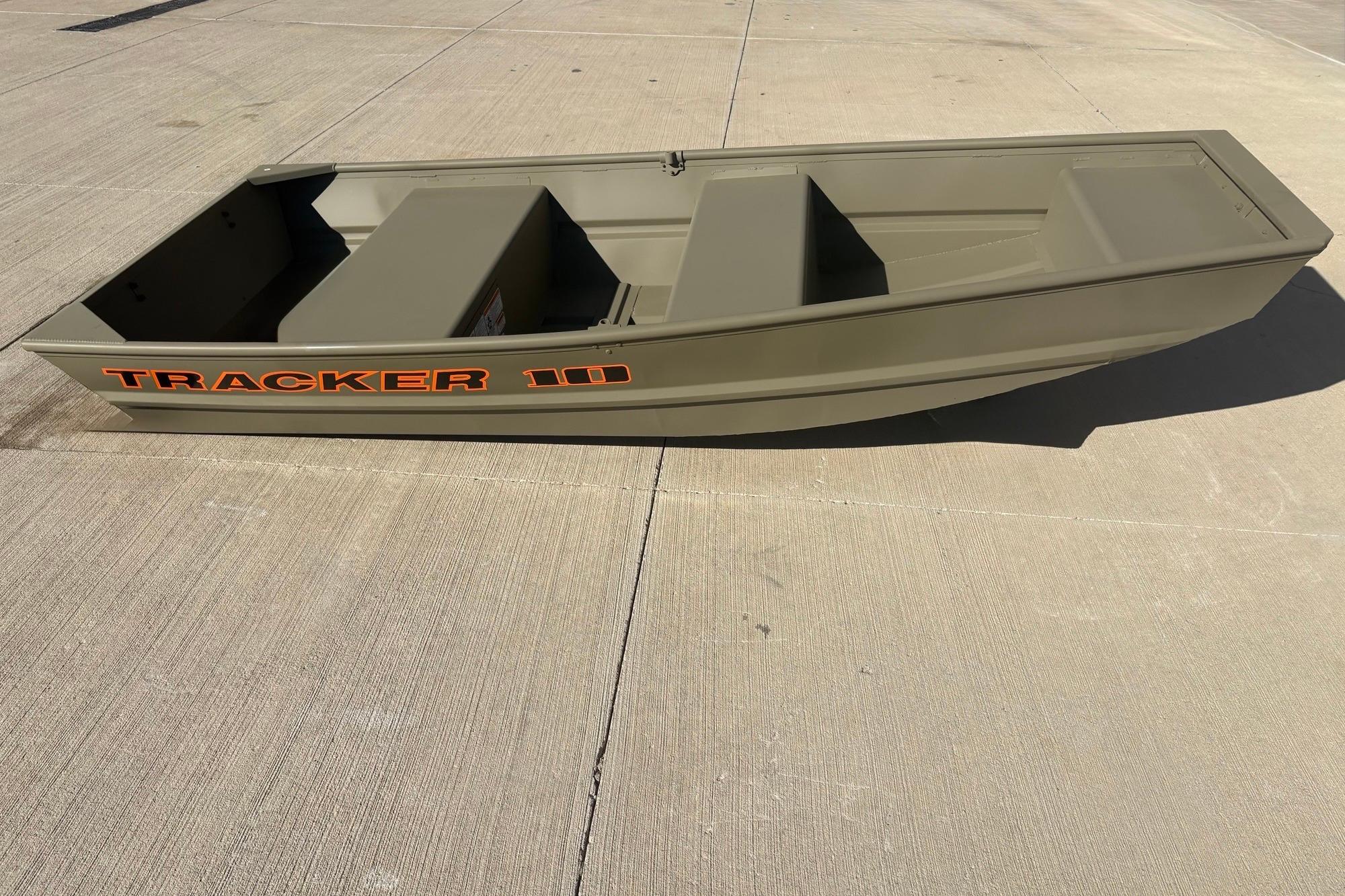 2026 Tracker Grizzly 10 Jon boat on concrete surface, showcasing its compact design.