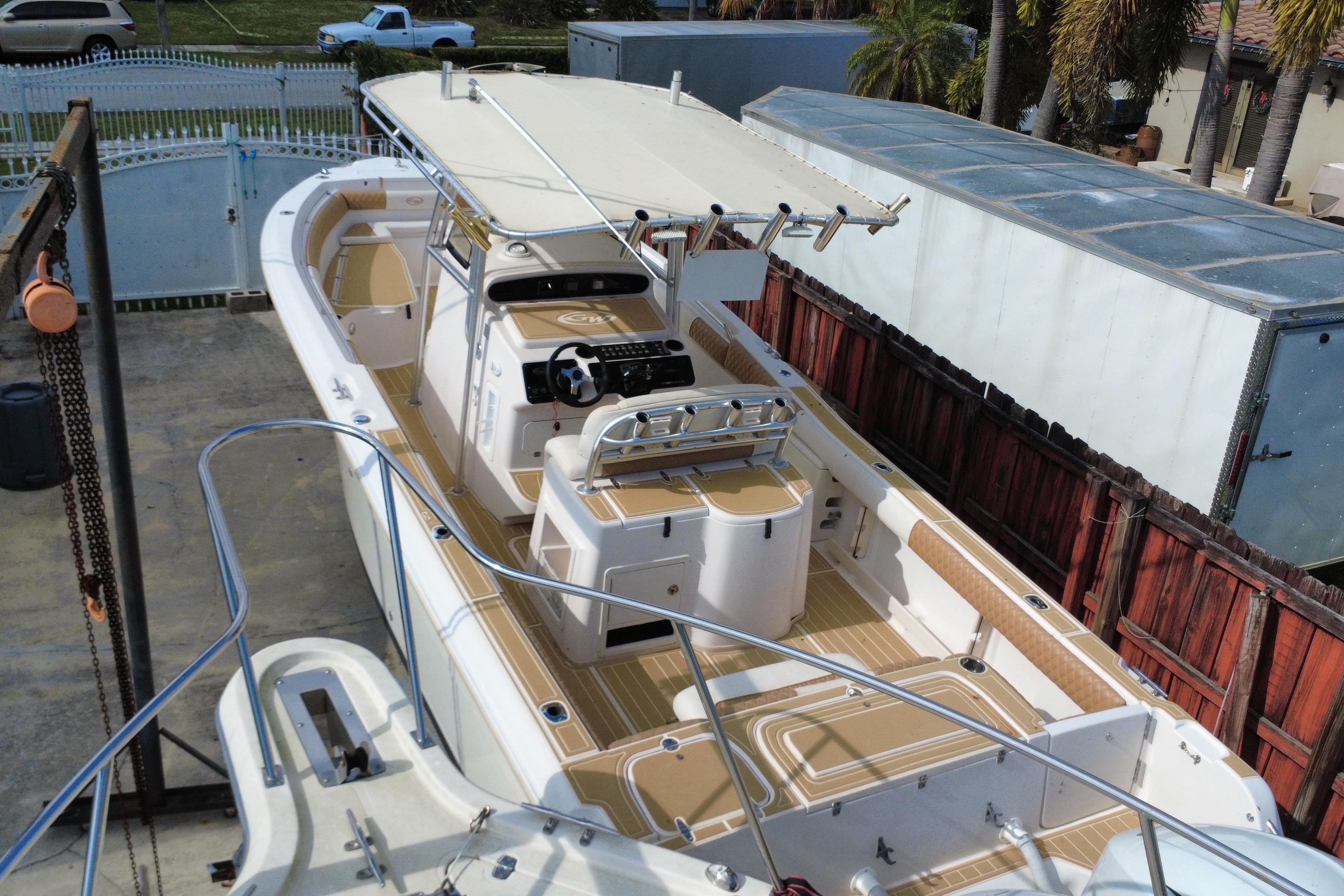2004 Grady-White Canyon 283 boat with spacious deck and modern helm station.