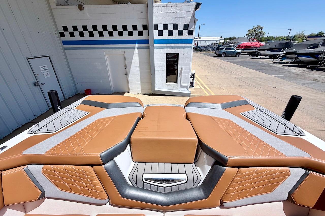 2021 Nautique Super Air Nautique G23 boat interior with tan and gray seating.
