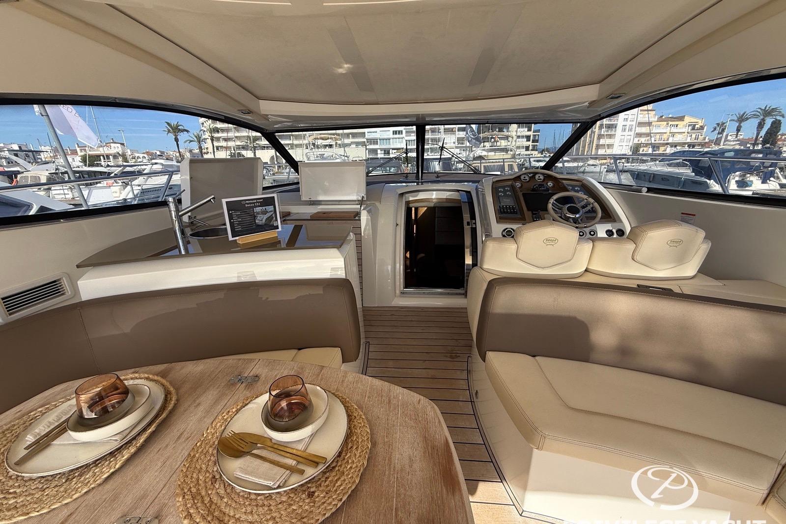 Luxurious interior of 2009 Sessa Marine C52 yacht with elegant dining setup.